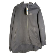 Nike Sportswear Tech Fleece women's oversized full-zip hoodie in black, front view showing the Nike logo and zip closure.