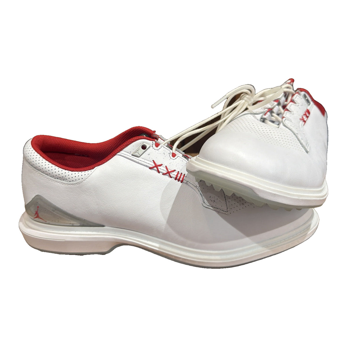 Nike Jordan ADG 4 golf shoes in white and gym red, men's size 11, showing the sporty design and Nike Jordan branding