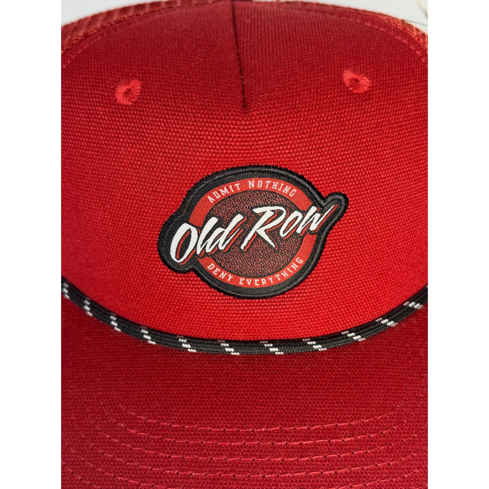 Old Row logo rope trucker hat in red snapback style, adult one size baseball cap with embroidered branding and adjustable back.
