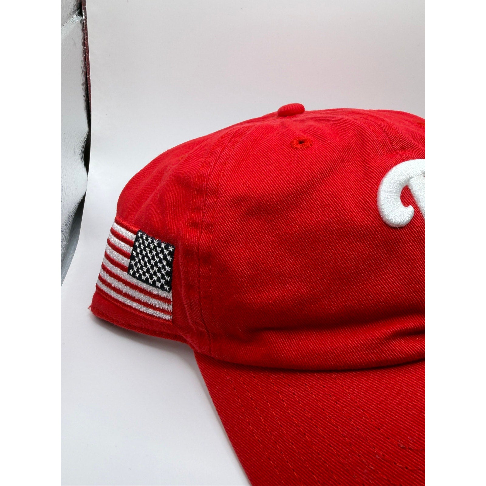 Philadelphia Phillies MLB 47 red adjustable strapback hat with USA flag patch, one size fits most, casual sports fan accessory.