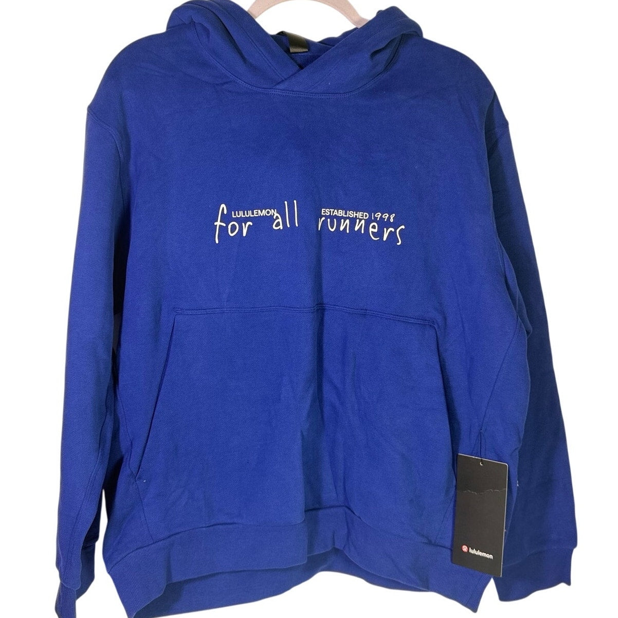 Lululemon women's blue For All Runners graphic hoodie, size M, showing front view with logo and design details.