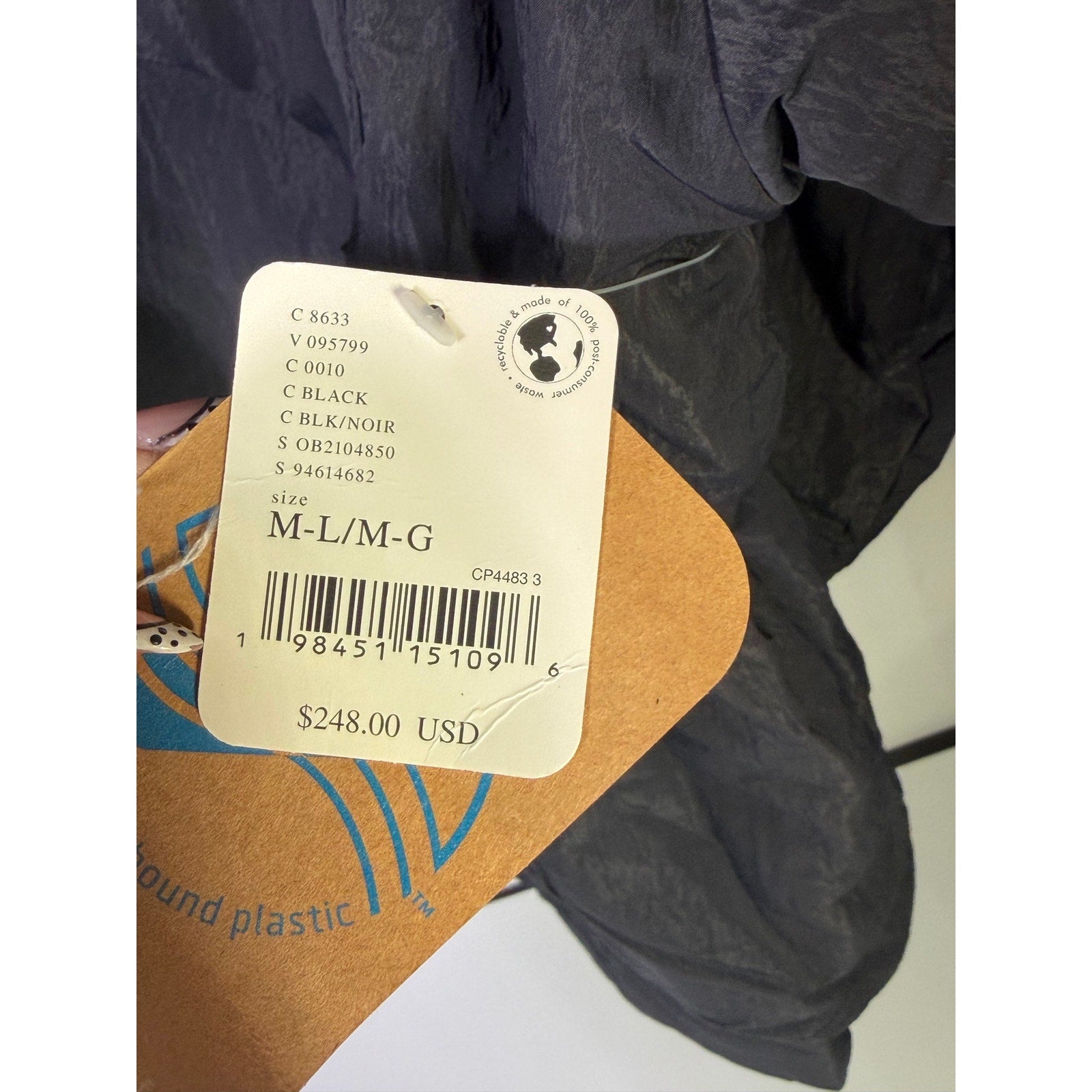 Black hooded utility jacket for women by Free People, featuring a hoodie and functional design, size M/L.