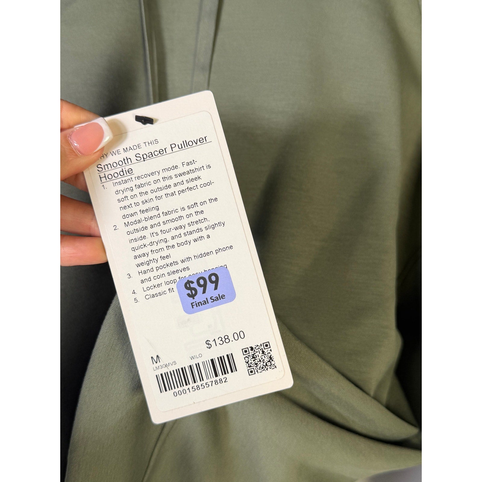 Men's green Lululemon Smooth Spacer Pullover Hoodie, medium size, showing the soft fabric and casual fit.