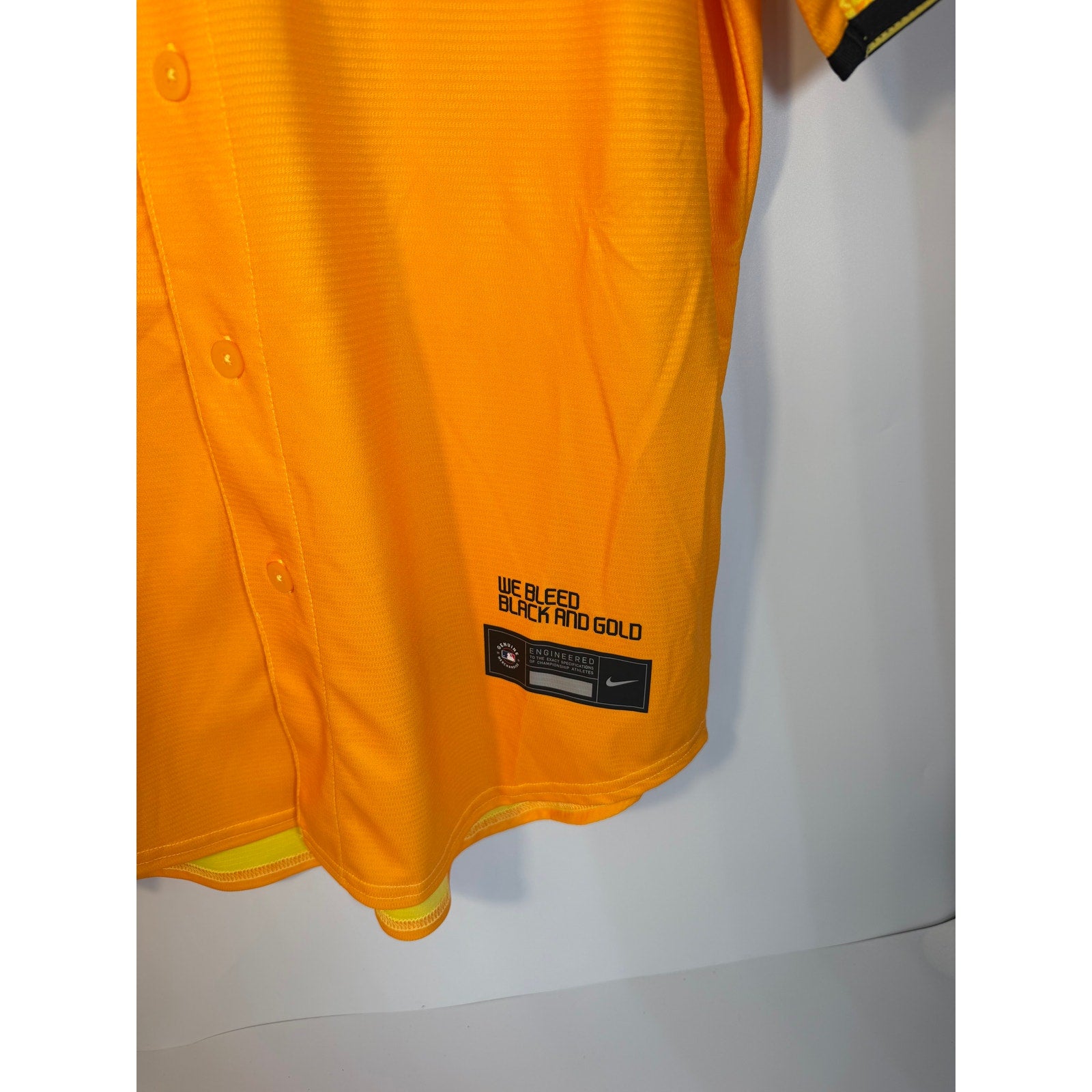 Nike Pittsburgh Pirates City Connect MLB jersey for men, gold color, large size, new with tags, featuring team logo and design details.