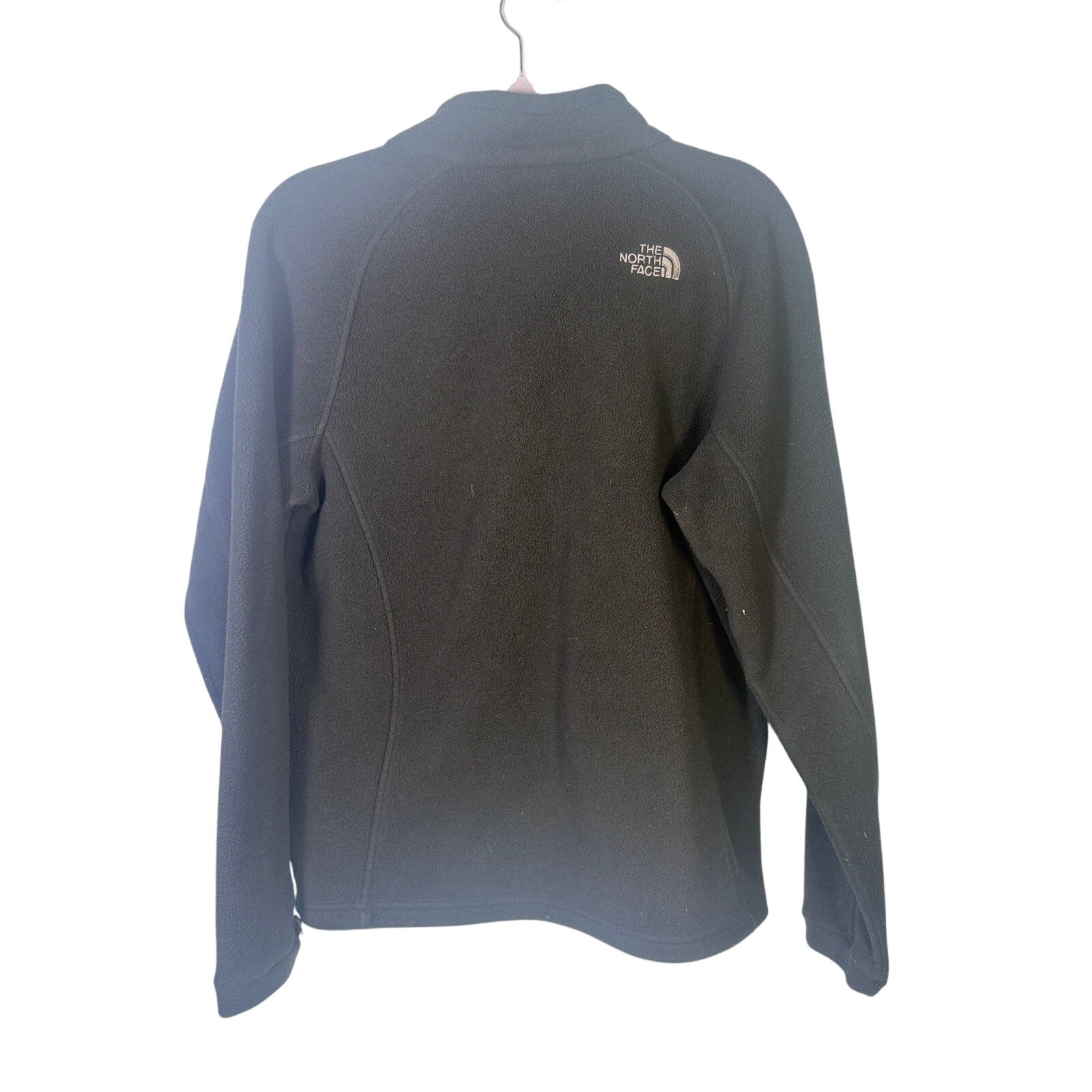 The North Face women's black XL full-zip fleece jacket with outdoor logo, showing the front view and zipper details.