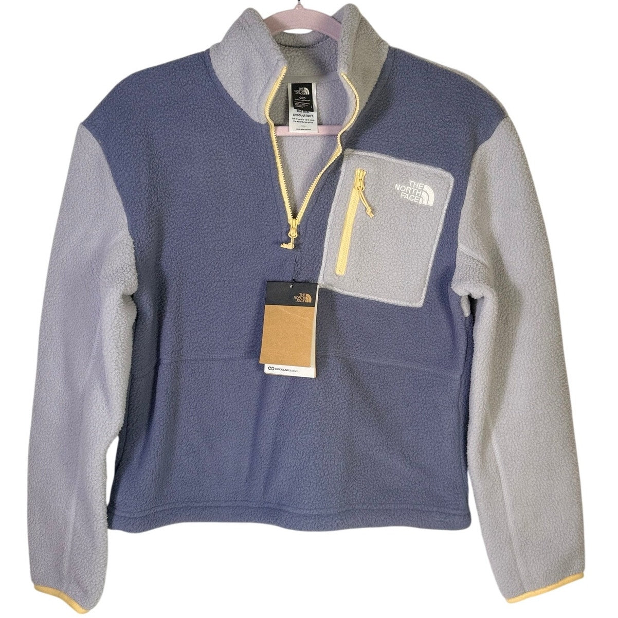 The North Face women’s Twilight Galaxy fleece pullover 1/4 zip sweater in size S, with a purple and blue galaxy pattern.
