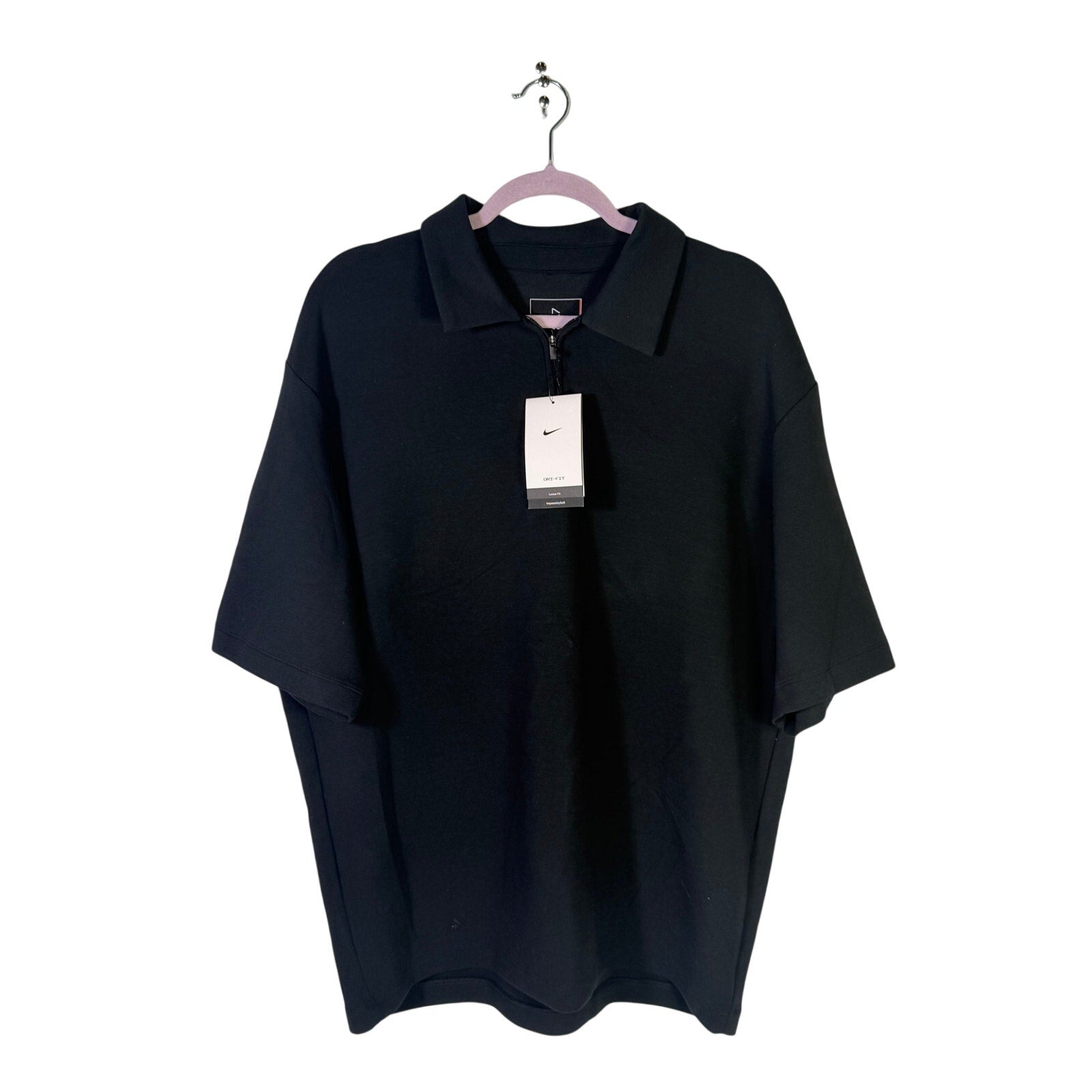 Nike Dri-FIT men's black 1/4 zip golf polo shirt, short sleeve, size L, new with tags, displayed on a plain background.
