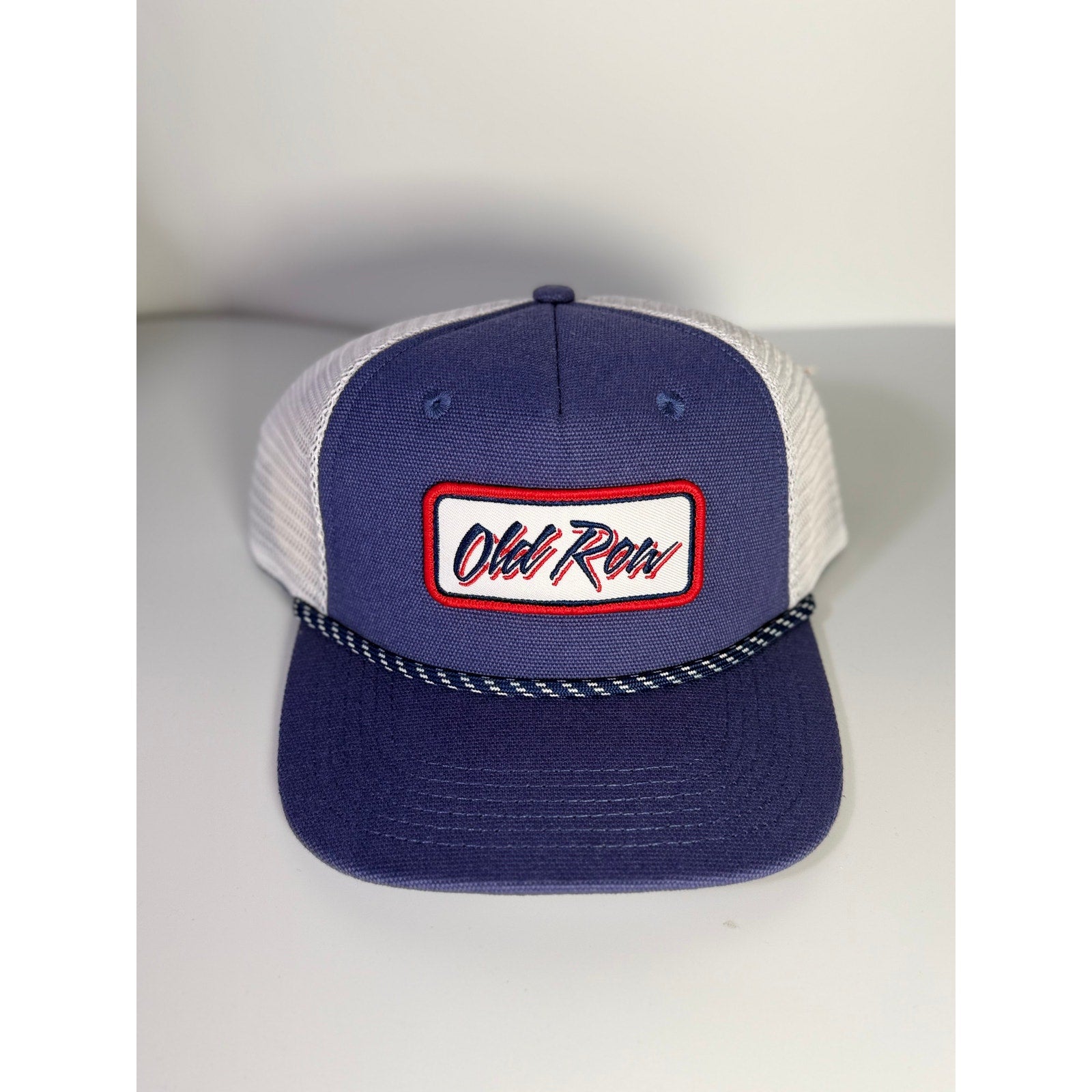 Old Row navy and white mesh trucker hat with rope detail, snapback closure, adult one size, new with tags.
