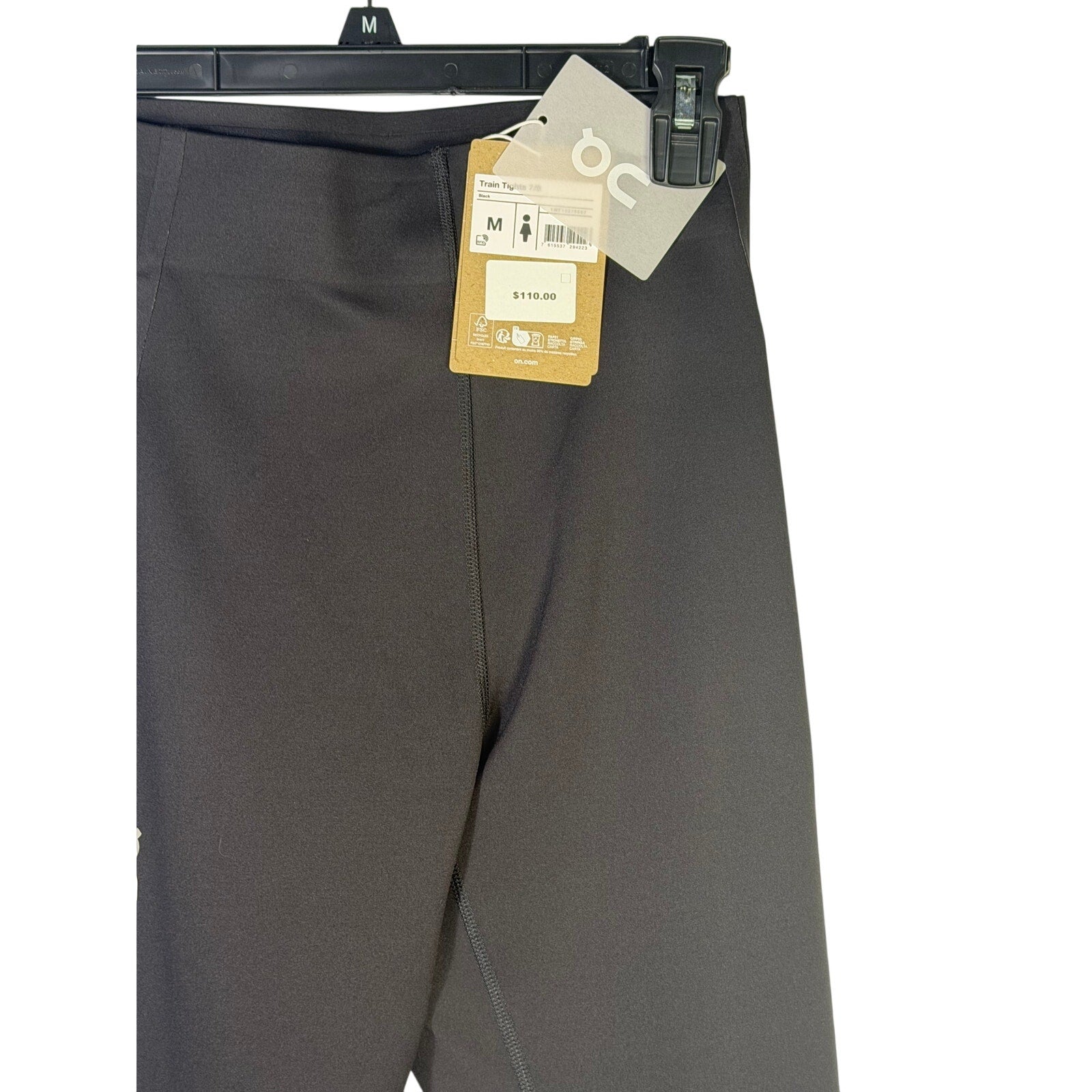 Black On Women’s Train Tights 7/8 leggings in size M, displayed flat with waistband and sleek fit, new with tags.