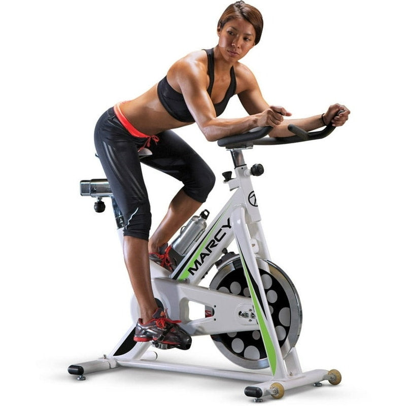 Marcy Club Deluxe Revolution Cycle indoor exercise bike with adjustable seat and handlebars, digital display, and sturdy frame.