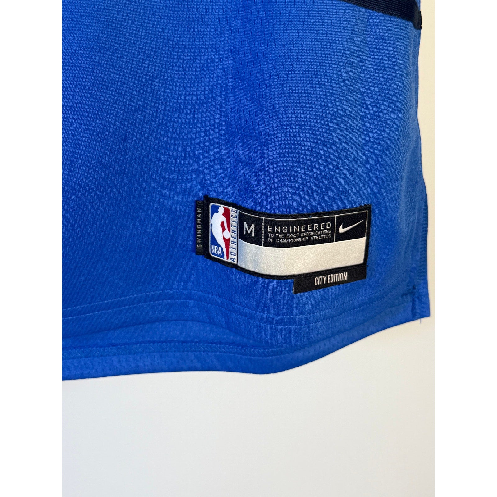 Nike Milwaukee Bucks Damian Lillard #0 City Edition youth jersey, size M, featuring team logo and player number on front.