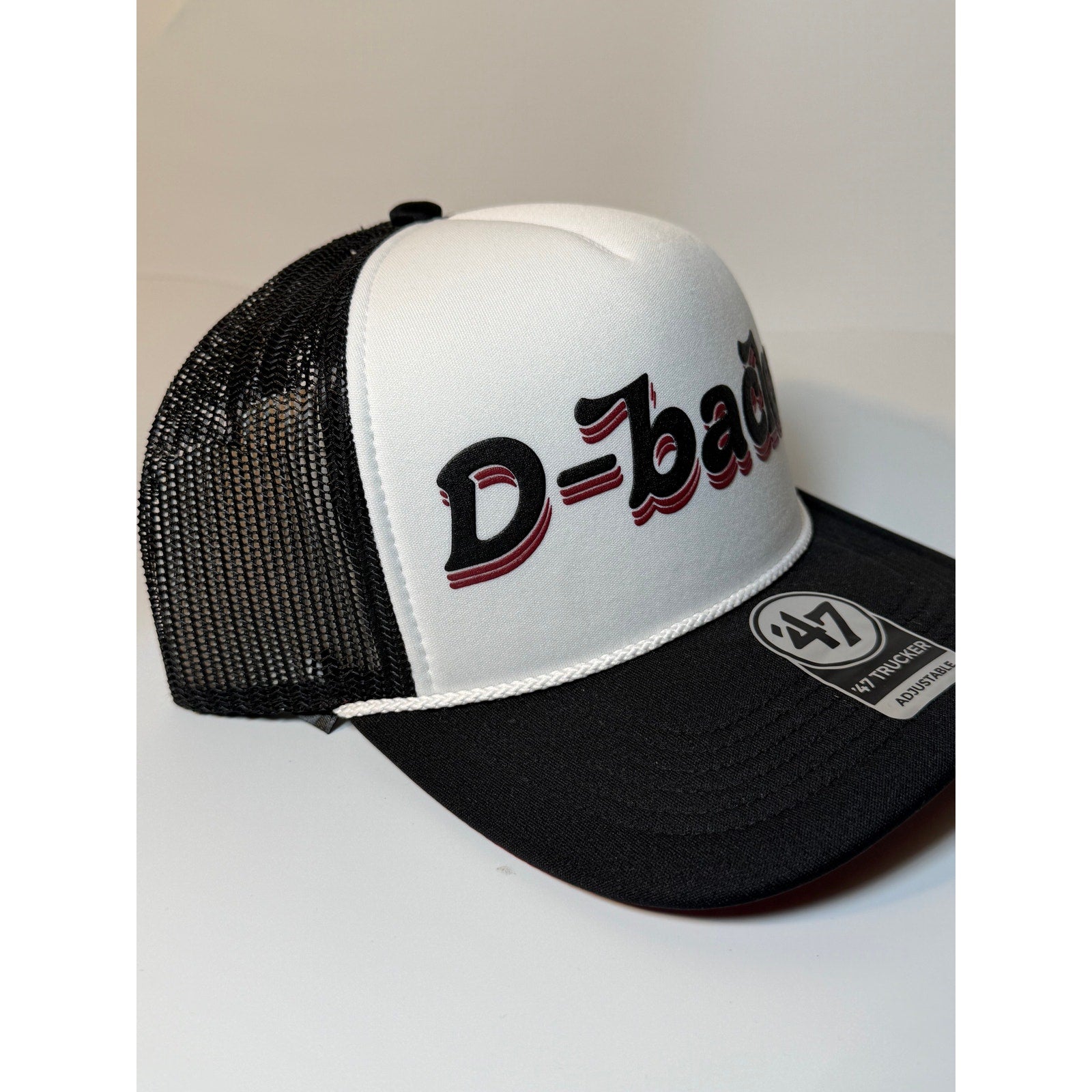 Black and white Arizona Diamondbacks trucker hat by 47 Brand with mesh back and adjustable snap closure.