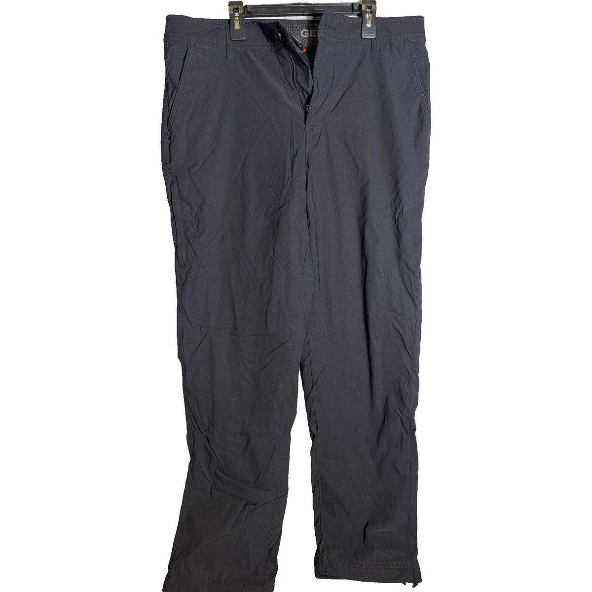 Black Gerry men's fleece-lined stretch pants in size 32x32, showing the fitted waistband and smooth fabric.