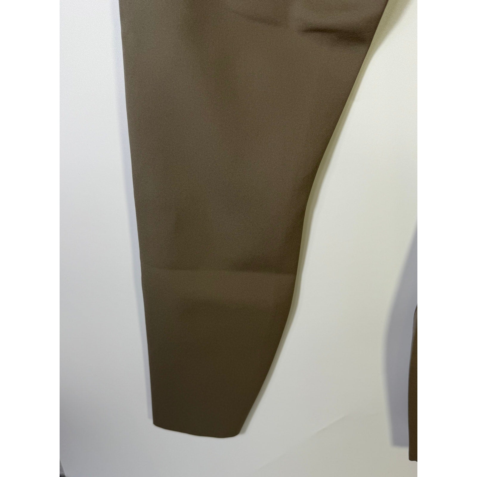 Lululemon Glow Up super-high-rise gray leggings in size 8, made from stretchy athletic fabric, shown laid flat.