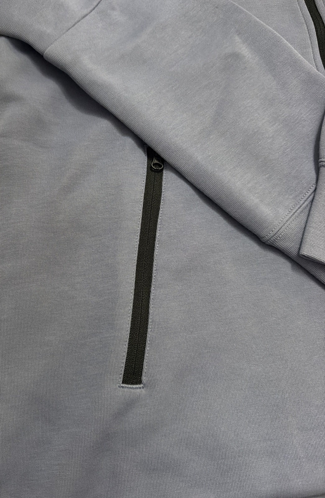 Nike Sportswear Tech Fleece Windrunner women's full zip hoodie in blue, showing the front view with Nike logo and zip closure.