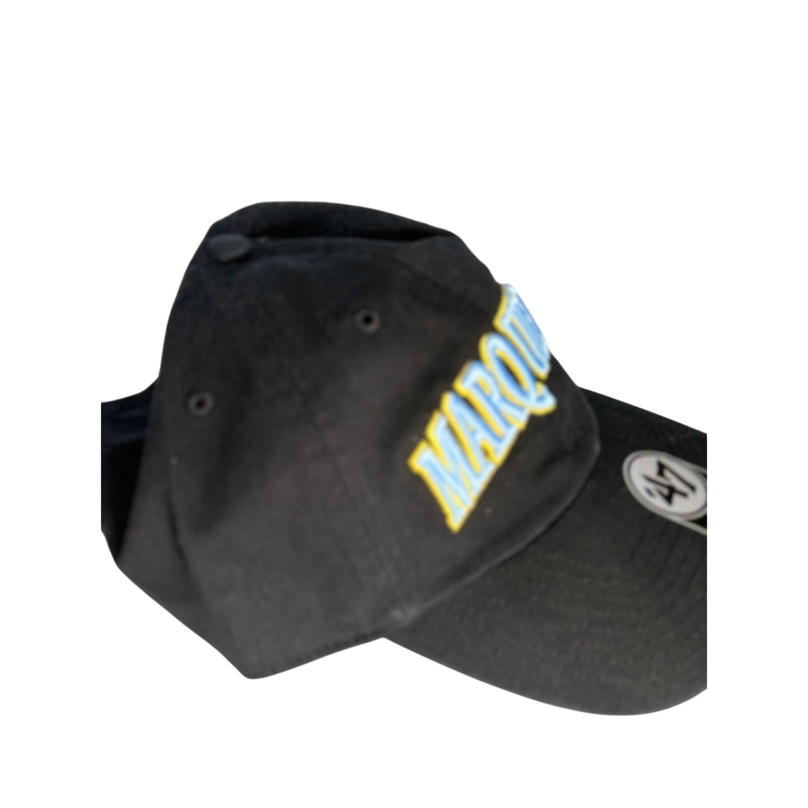 Black '47 Marquette Golden Eagles adjustable hat with embroidered team logo and curved brim.