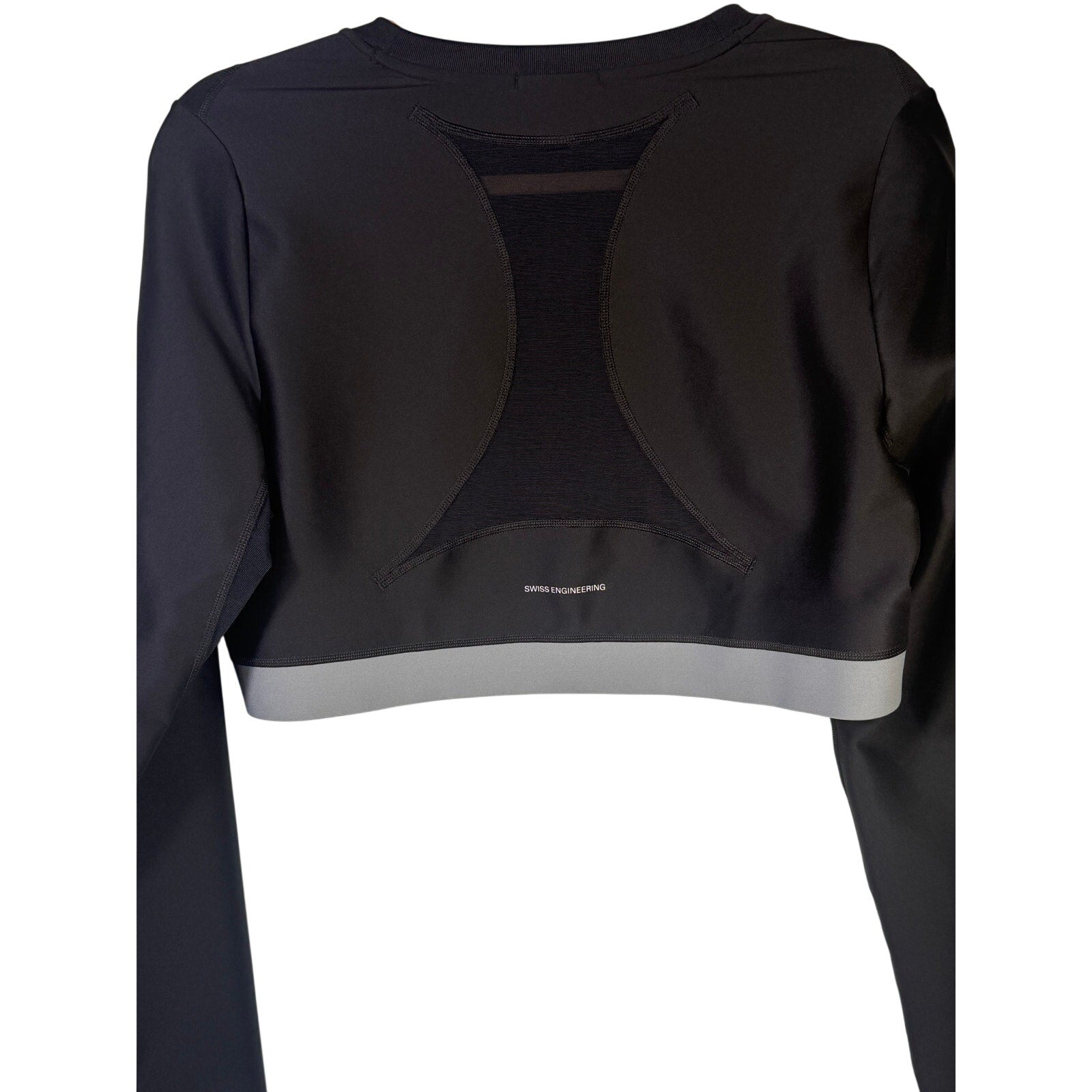 Black On Women’s Train long-sleeve crop athletic top in size XL, shown on a hanger with a fitted, sleek design.