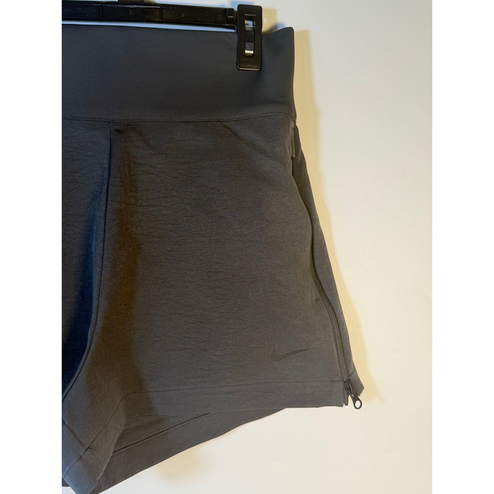 Nike Dri-FIT Flex Bliss Luxe women's running shorts in gray, high-rise design, lightweight and comfortable for active wear.