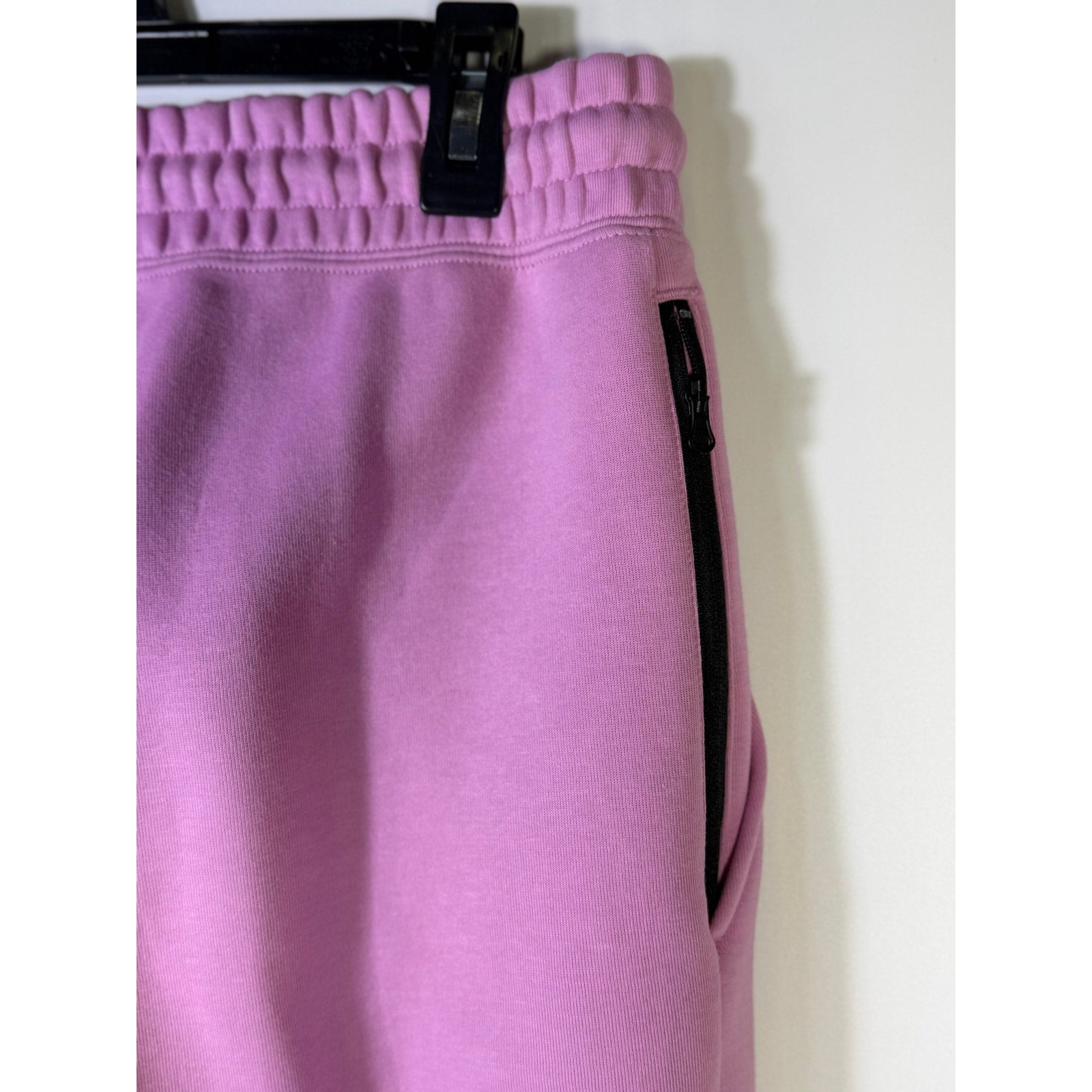 Nike Sportswear Phoenix fleece jogger sweatpants for women, pink mid-rise fit, XS size, shown on model.