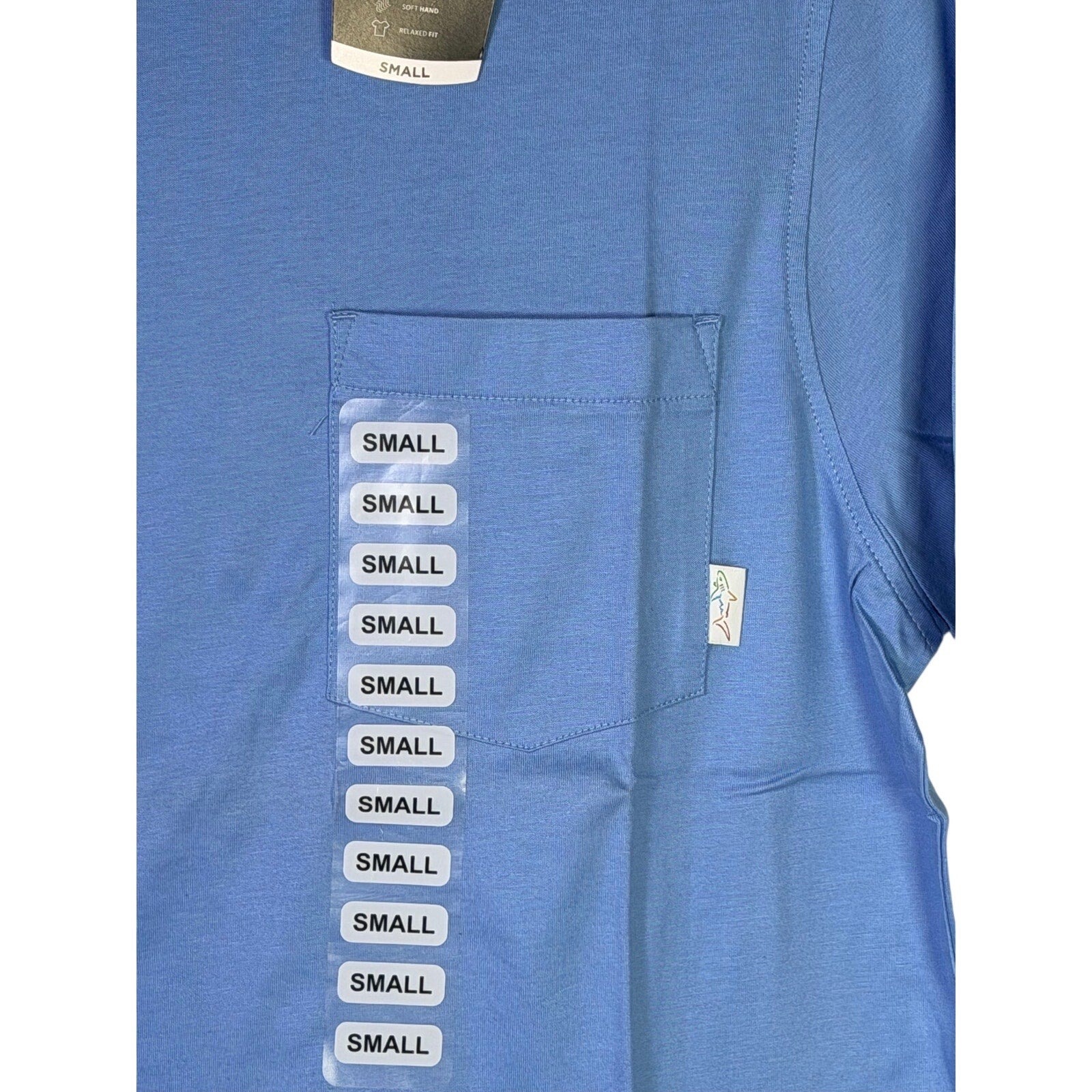 Greg Norman men's blue pocket T-shirt, relaxed fit, size small, with visible chest pocket and casual style.