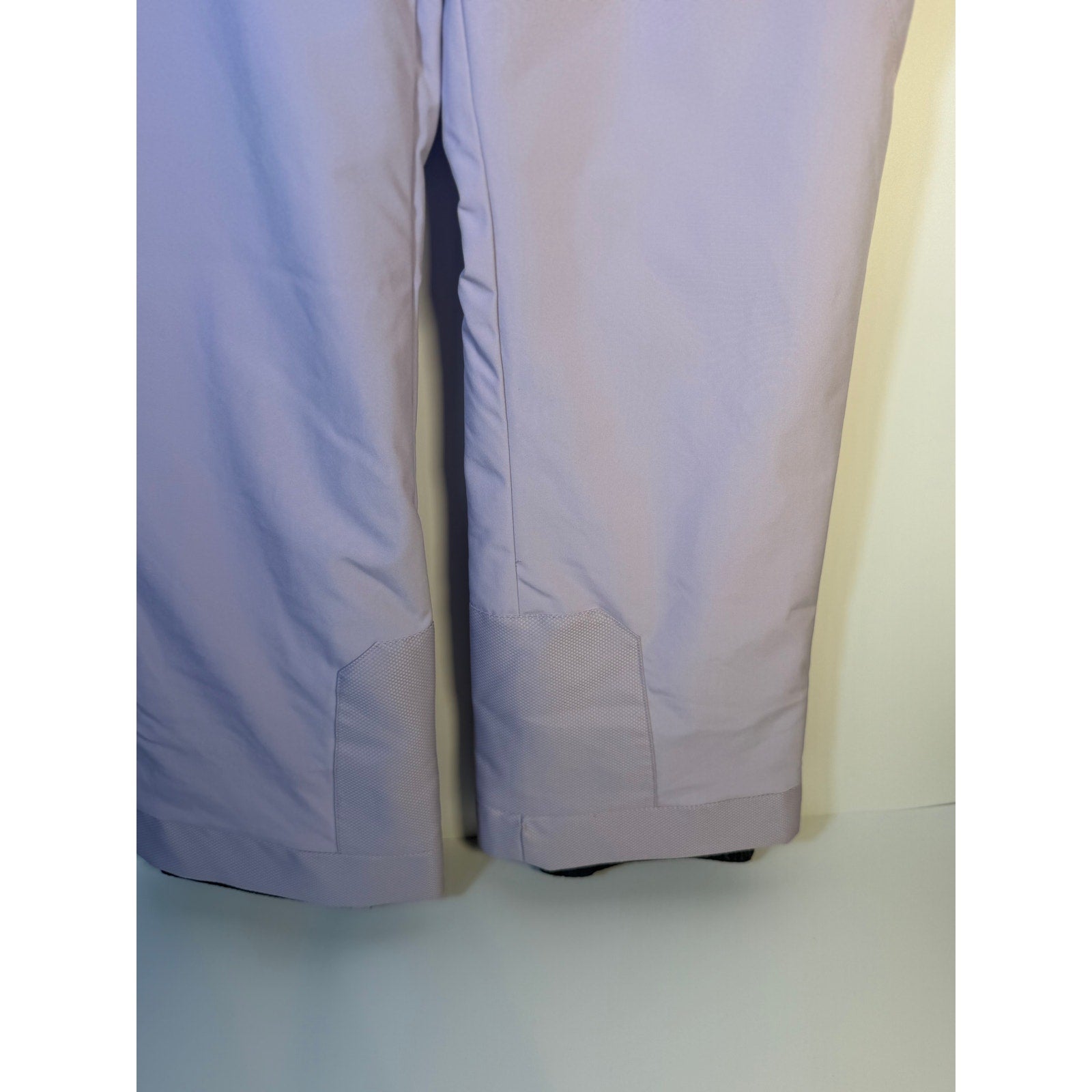 Spyder Women's Olympia ski snow pants in lavender, size 16, with EXO Tech and Thermo insulation, showing the padded, waterproof design.