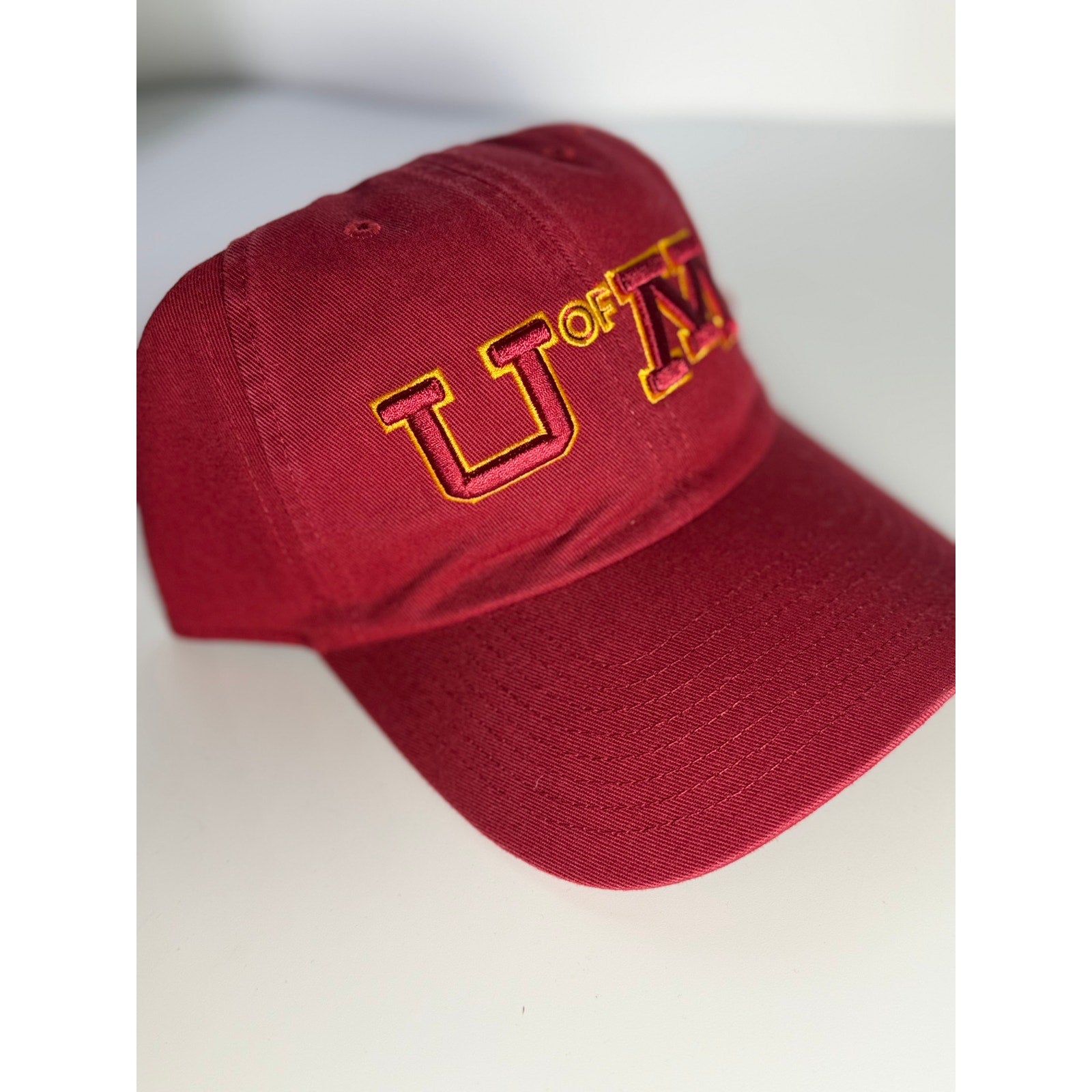 '47 University of Minnesota U of M adjustable maroon and gold dad hat with embroidered logo and OSFM fit.