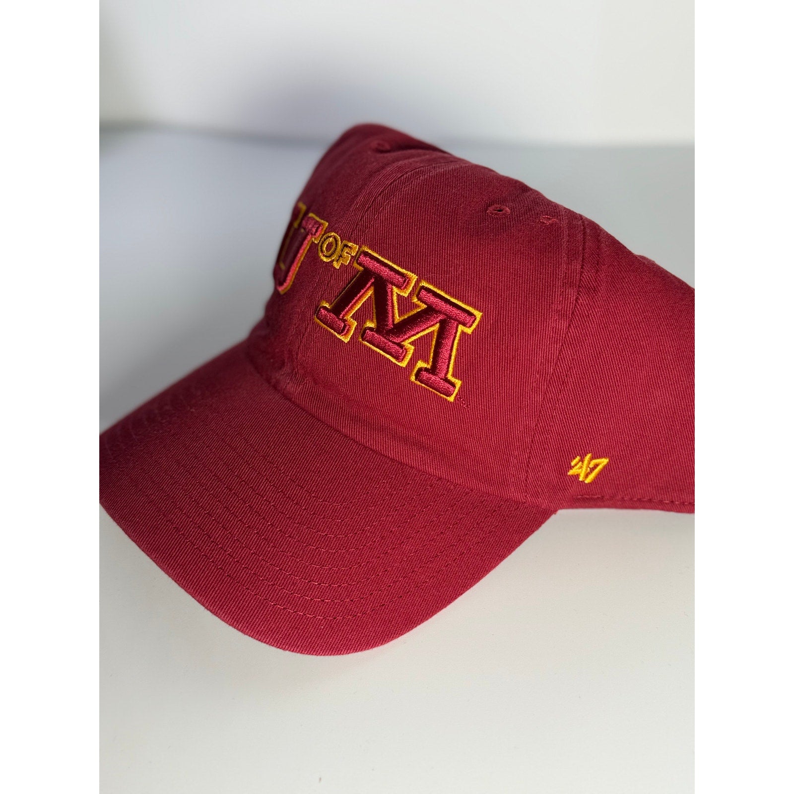'47 University of Minnesota U of M adjustable maroon and gold dad hat with embroidered team logo and OSFM fit.