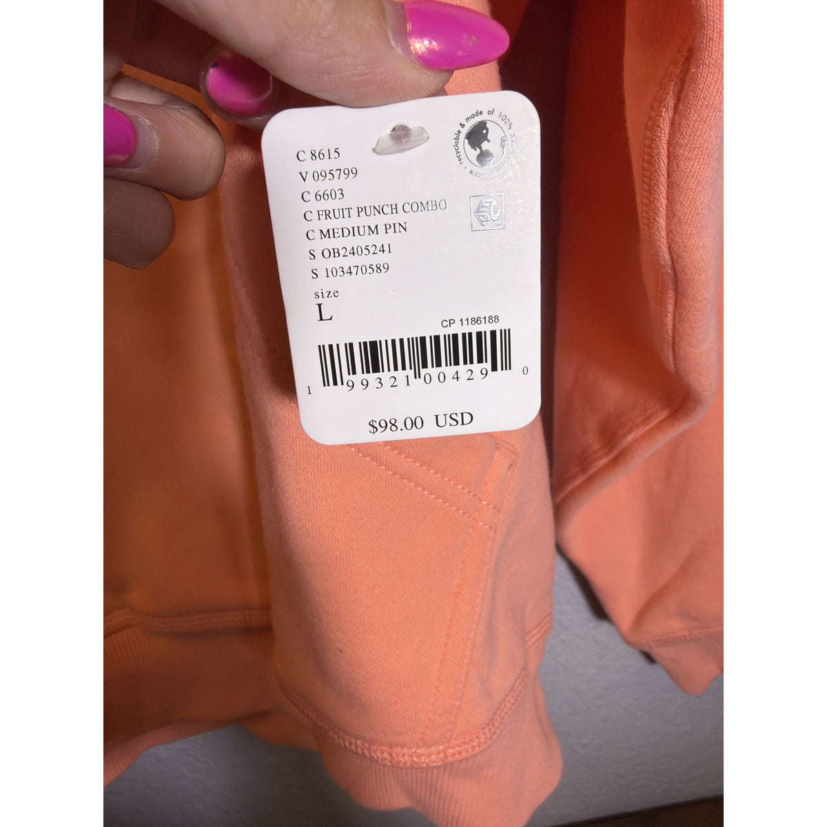 Women's oversized Free People FP Movement logo hoodie in fruit punch color, featuring a relaxed fit and front logo design.