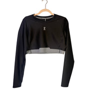 On women's black Train long-sleeve crop athletic top, size XL, made for active wear, shown on a hanger.
