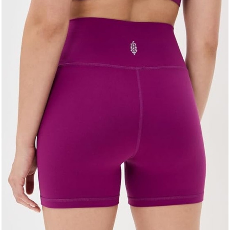 Free People Movement Never Better bike shorts in mulberry color, size large, shown laid flat on a white background.