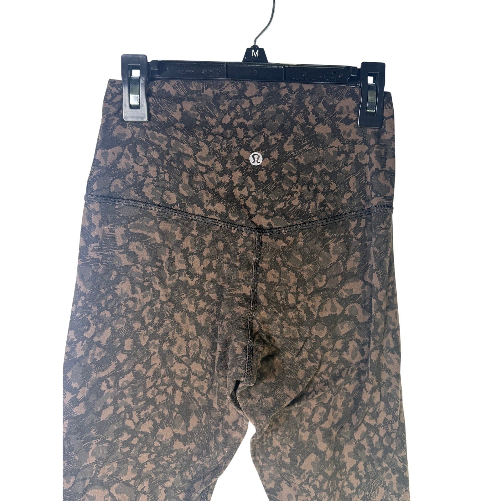 Lululemon Women’s Align high-rise leggings in brown and black camo, size 4, featuring a sleek fit and 25-inch length.