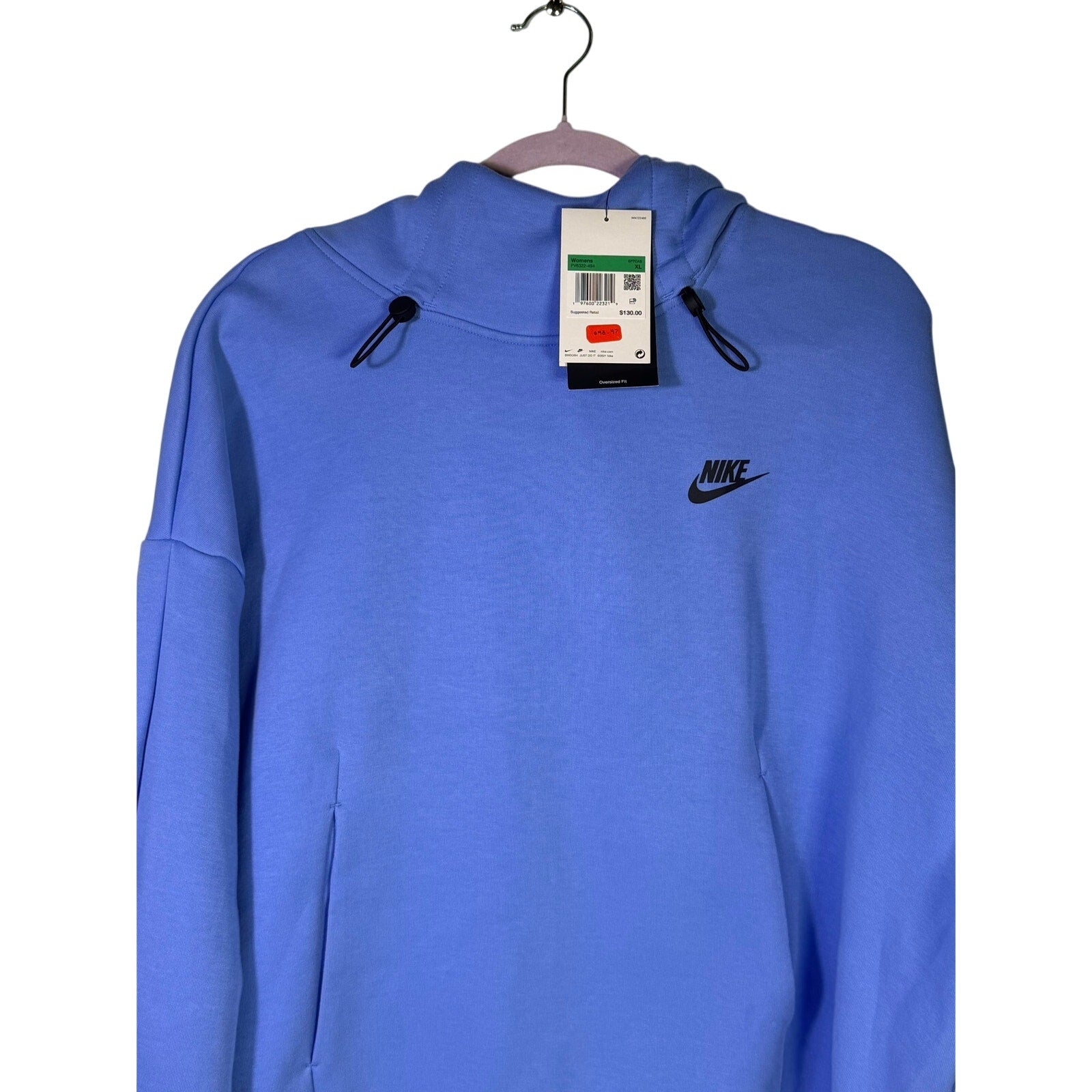 Blue Nike Sportswear women's oversized fleece hoodie, size XL, displayed on a hanger with soft fabric and relaxed fit.