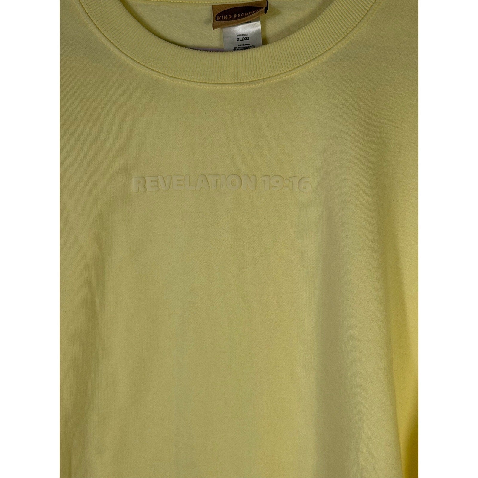 Yellow crewneck sweatshirt by Kind Regards featuring Revelation 19:16 Jesus Is King text, displayed on the front.