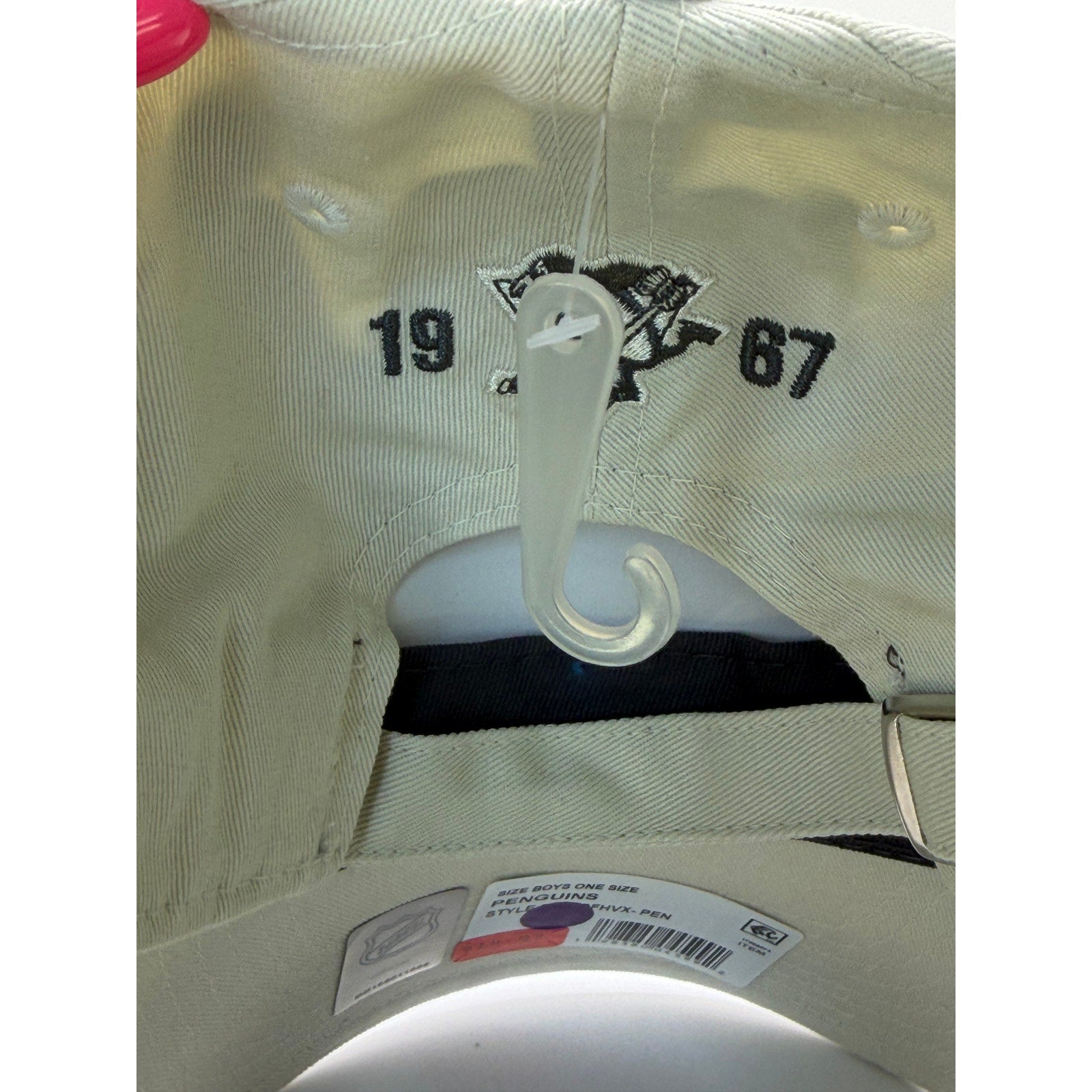 Beige NHL youth adjustable strapback hat featuring Pittsburgh Penguins logo, one size fits most, new with tags.