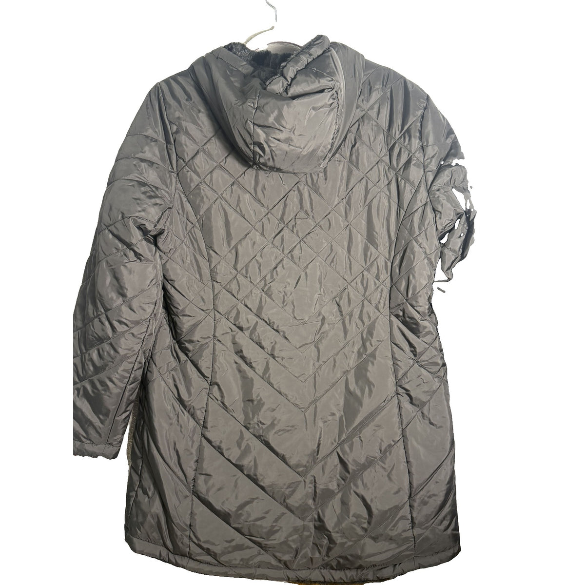 Women's black Free Country Cloud Lite reversible quilted faux fur hooded jacket, showing the quilted exterior and plush faux fur lining.