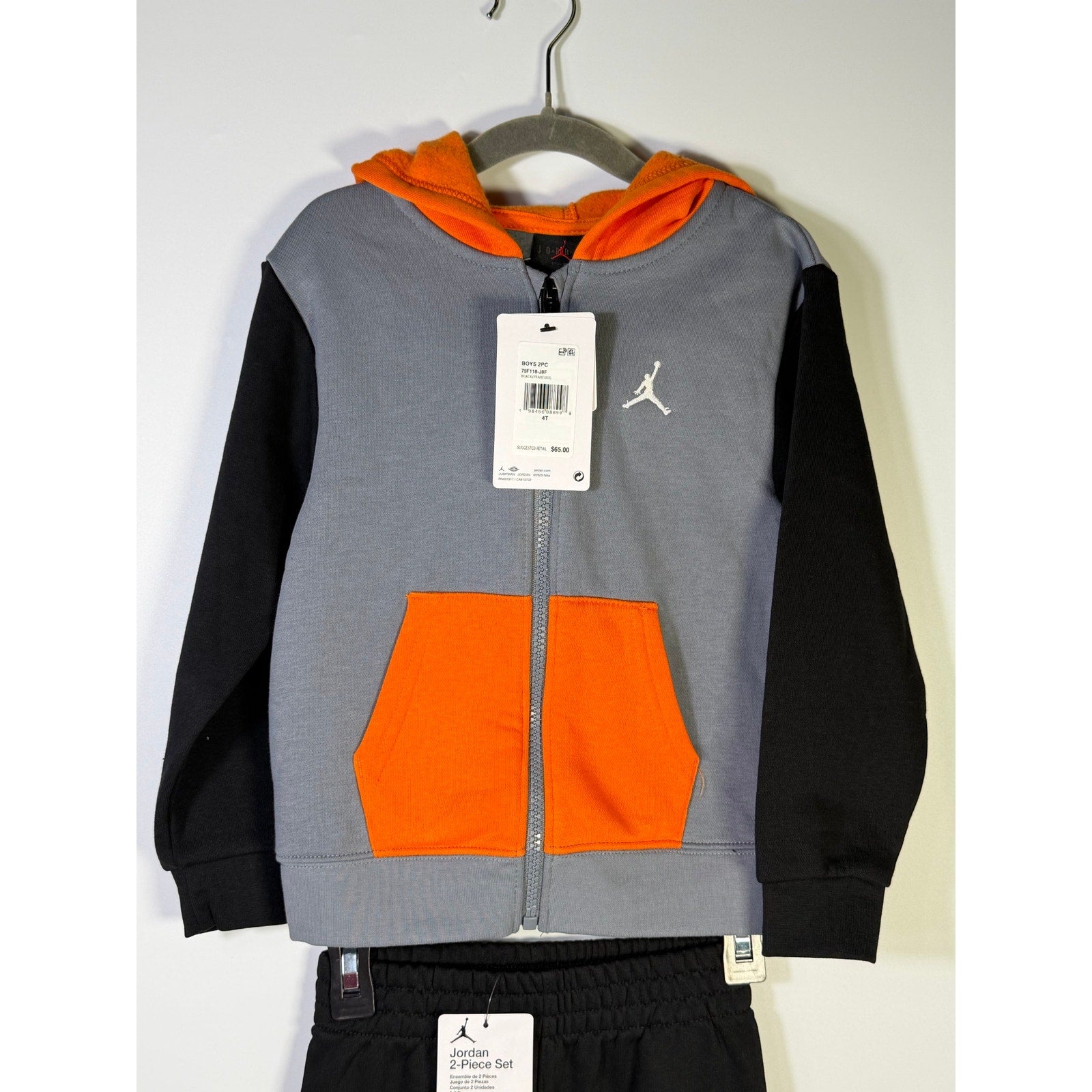 Jordan boys’ 2-piece gray, black, and orange hoodie and jogger pants set for 4T, new with tags.