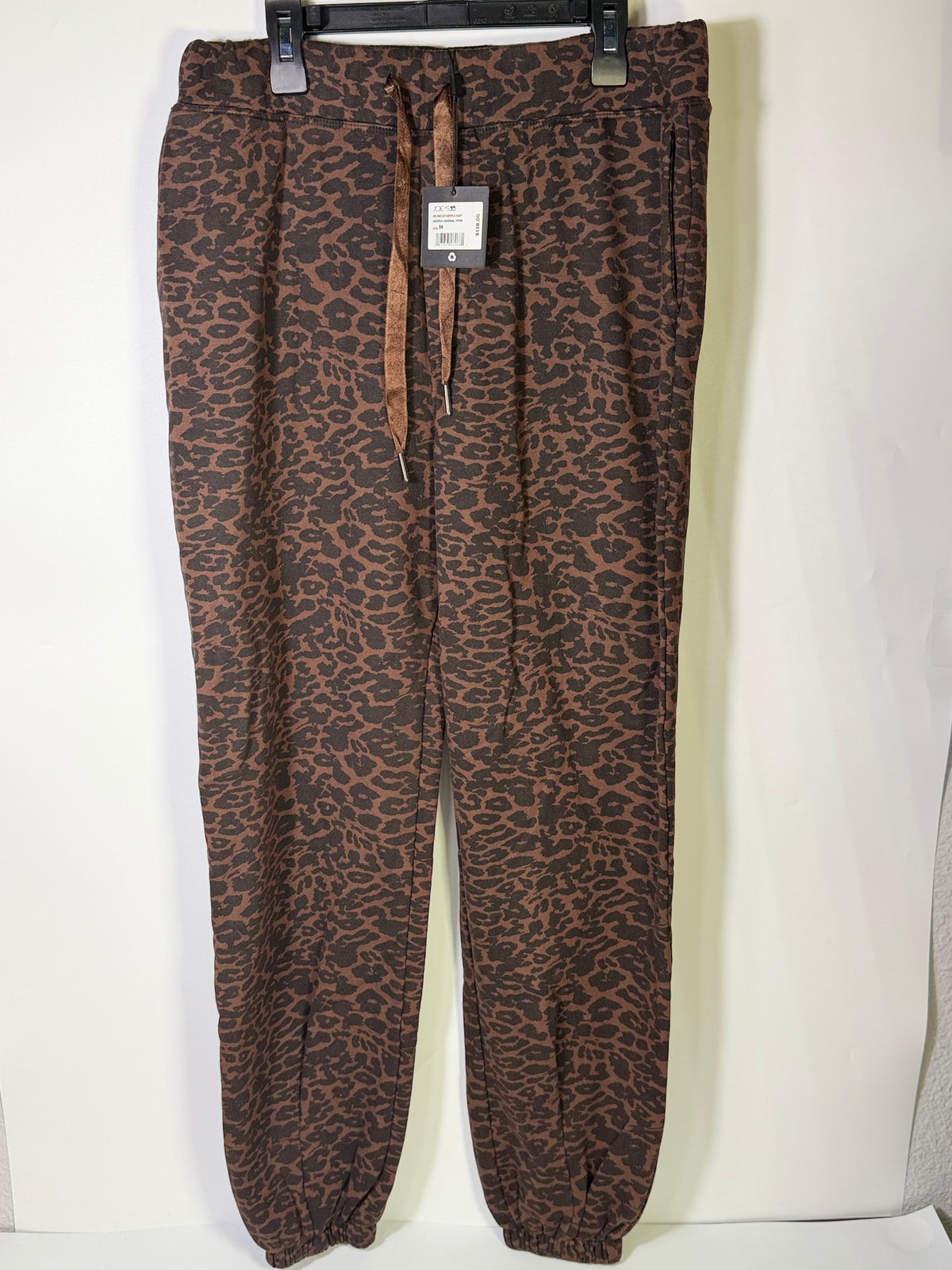 Joe's Sierra animal print jogger pants in brown, size M, featuring a relaxed fit and stylish animal pattern.