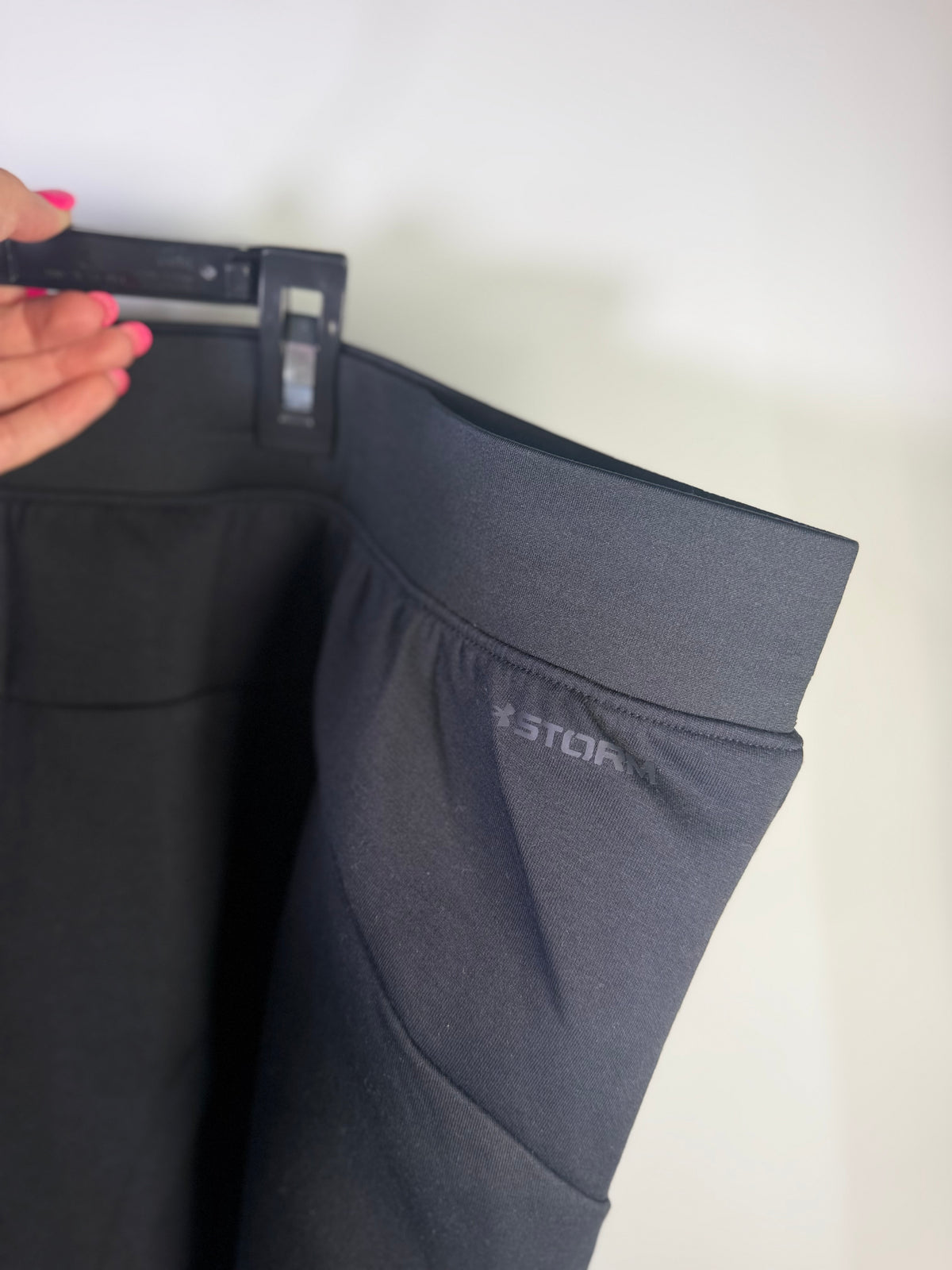Gray Under Armour athletic sweatpants in XXL laid flat, showing the relaxed fit and soft fabric for activewear or casual wear.