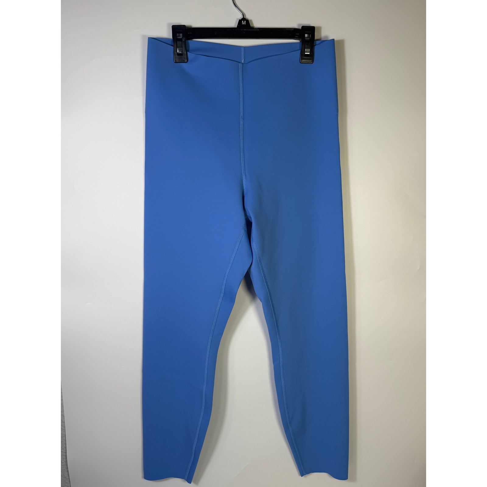 Lululemon Glow Up high-rise leggings in Pool Party Blue, size 14, showcasing the fitted, stretchable fabric and high waist design.