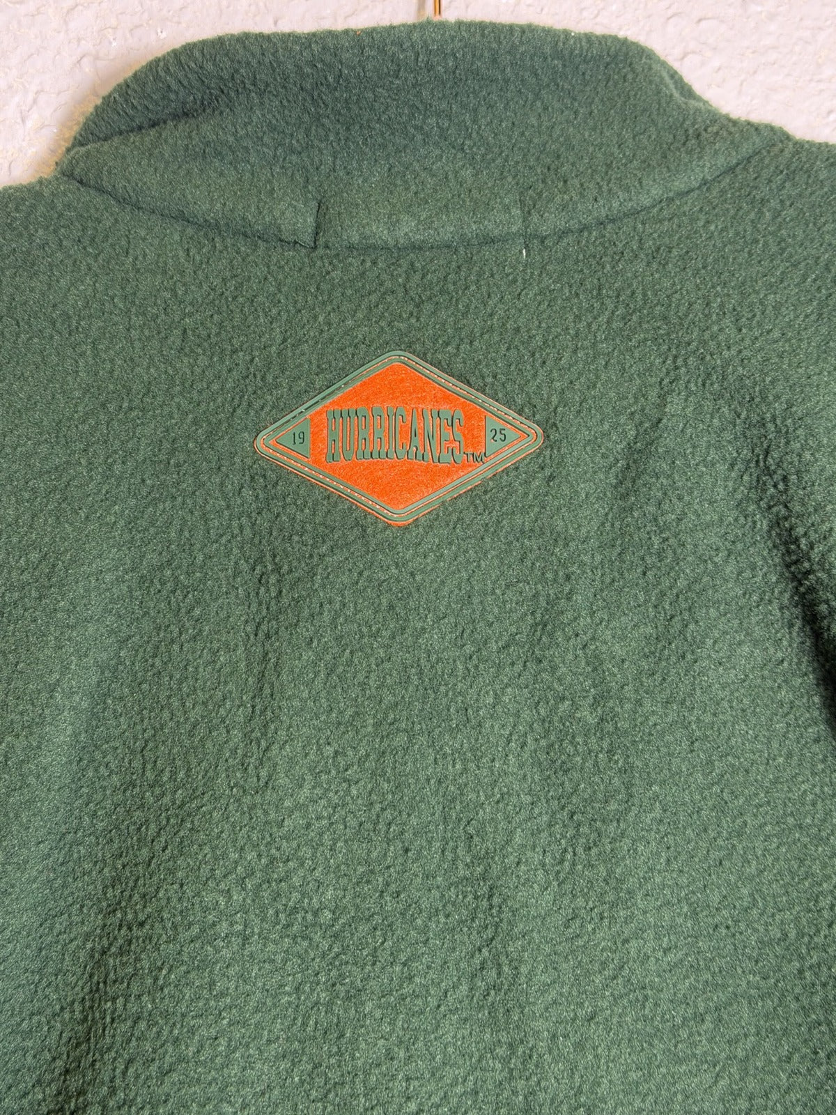 Green and orange Miami Hurricanes women's fleece 1/4 zip pullover by WEAR by Erin Andrews, size small, new with tags.