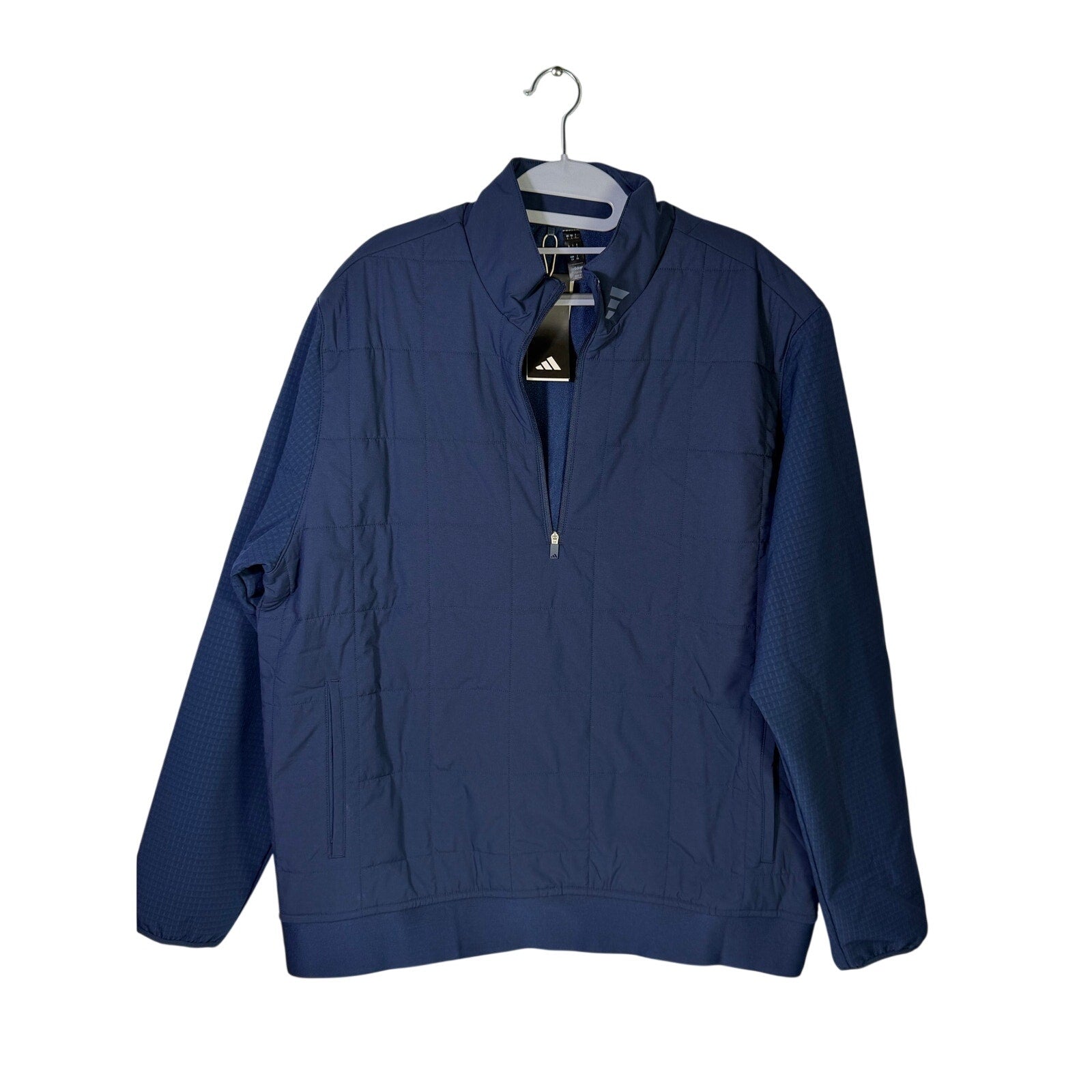 Adidas Ultimate365 quilted men's golf jacket in navy blue, size large, with DWR water-resistant fabric, displayed on a hanger.