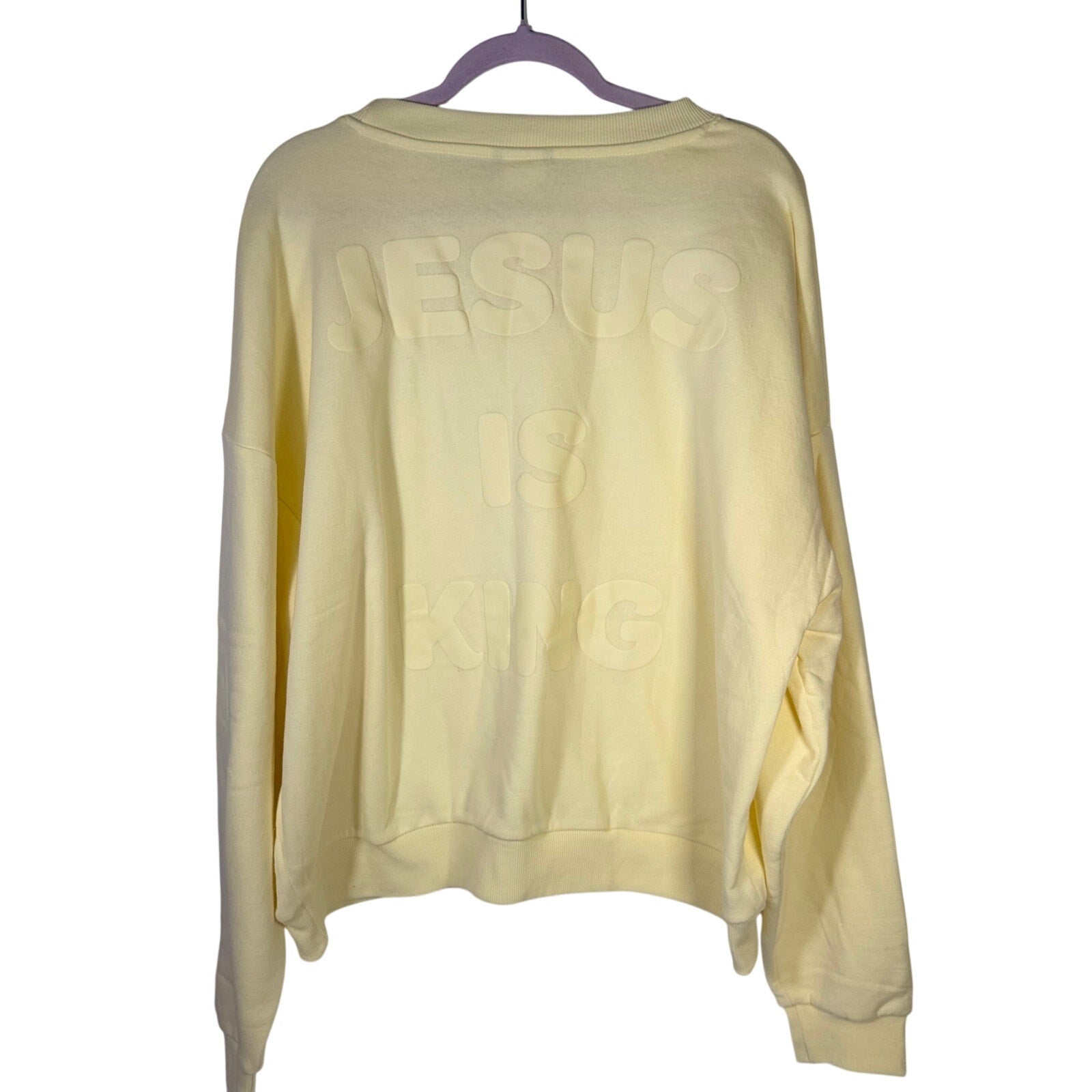 Yellow crewneck sweatshirt by Kind Regards featuring Revelation 19:16 Jesus Is King design, size XL, casual and comfortable fit.