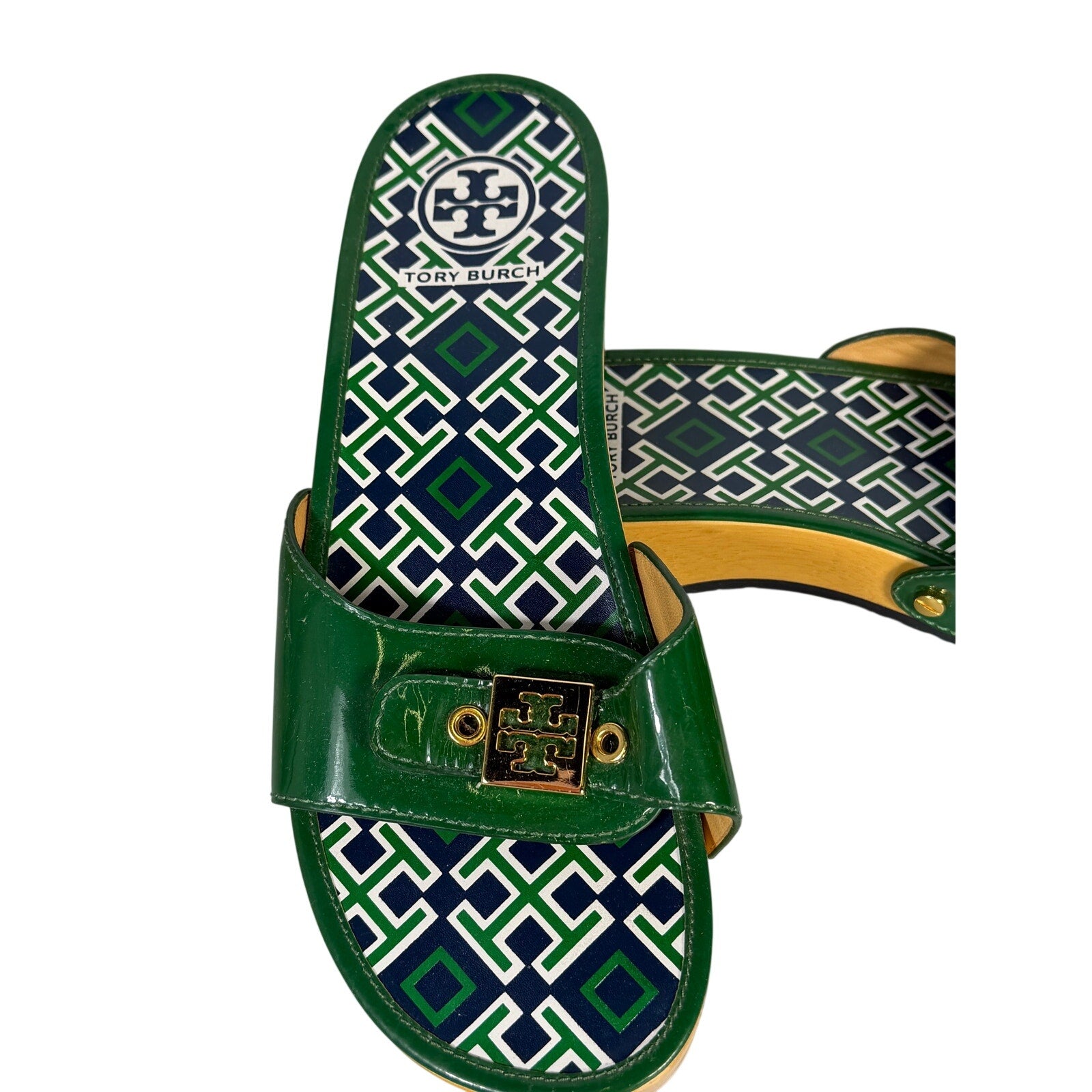 Tory Burch green patent leather slide sandals for women, size 8.5, featuring a sleek design and made in Brazil.
