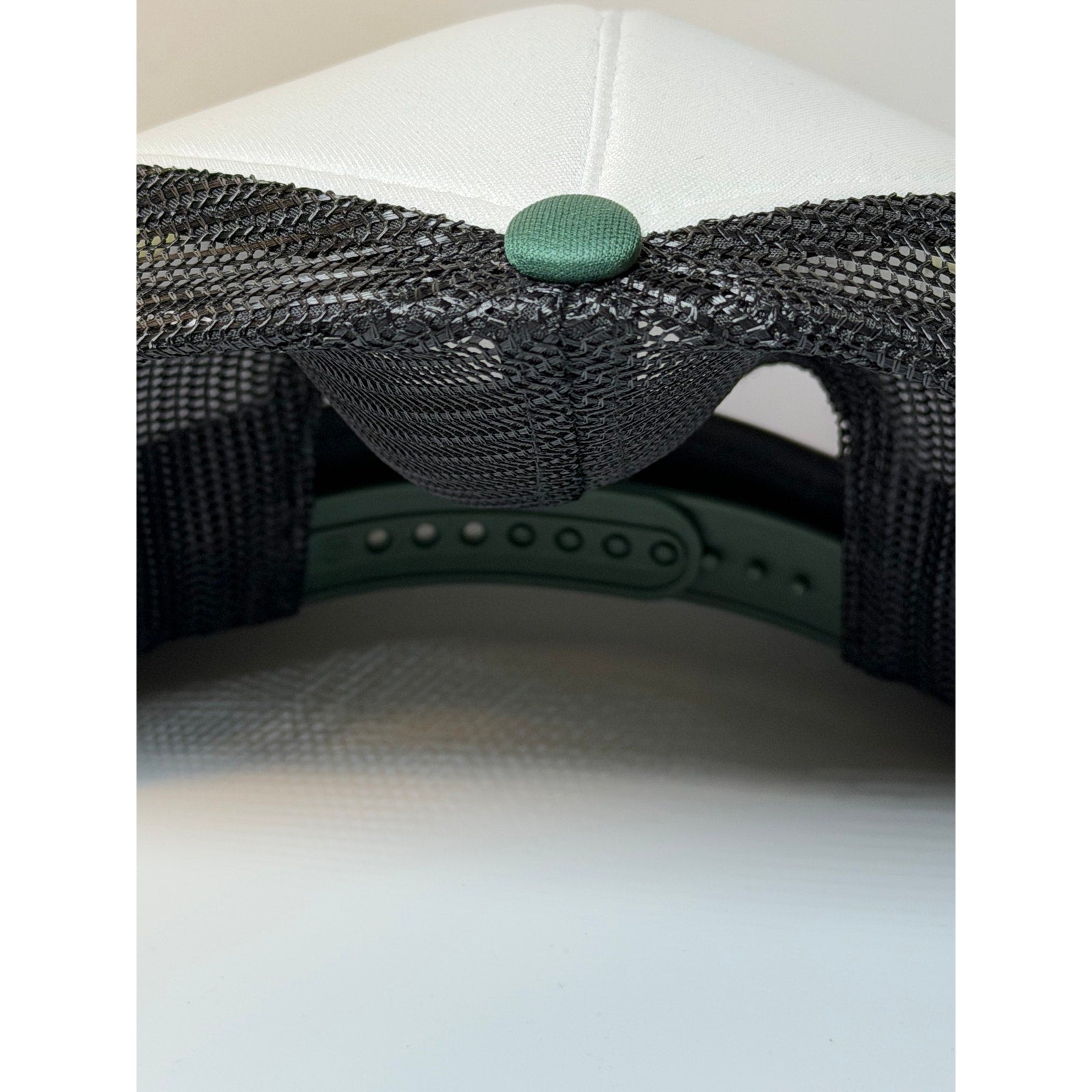 47 Brand Milwaukee Bucks trucker hat in green and white with adjustable snapback, featuring team logo and mesh back design.