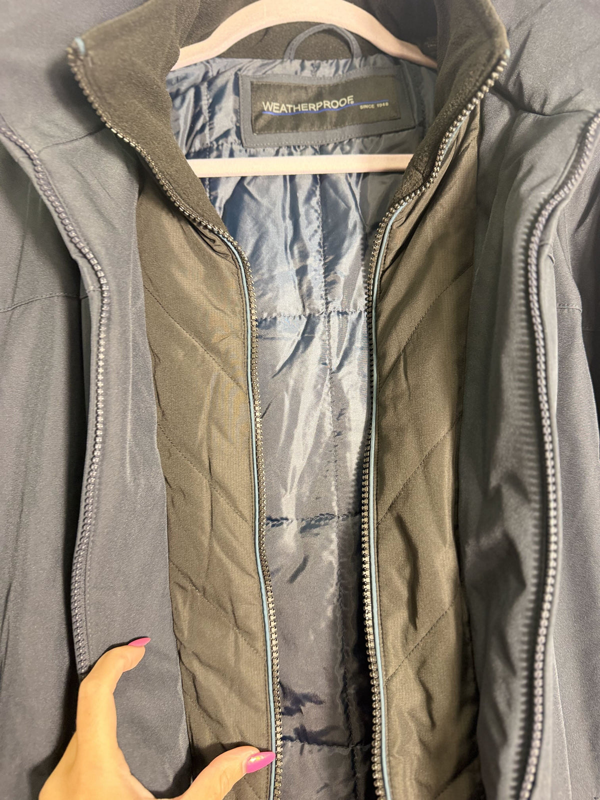 Weatherproof men's navy blue stretch tech hooded jacket with quilted bib, weatherproof design, large size, front zipper and hood.
