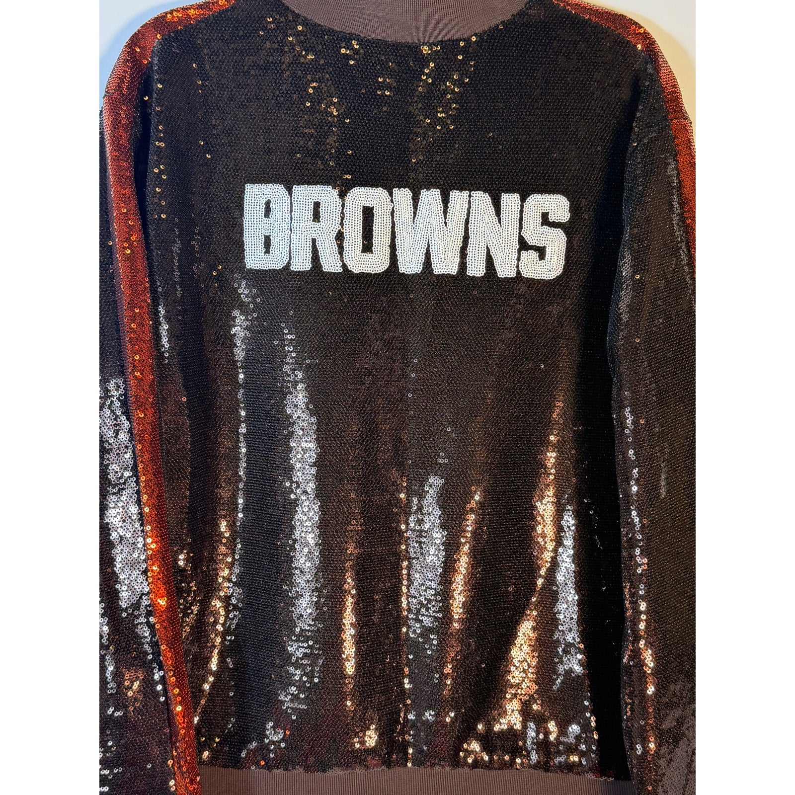 Women's XL Cleveland Browns sequin ombre bomber jacket by The Wild Collective, featuring vibrant color gradient and sporty style.
