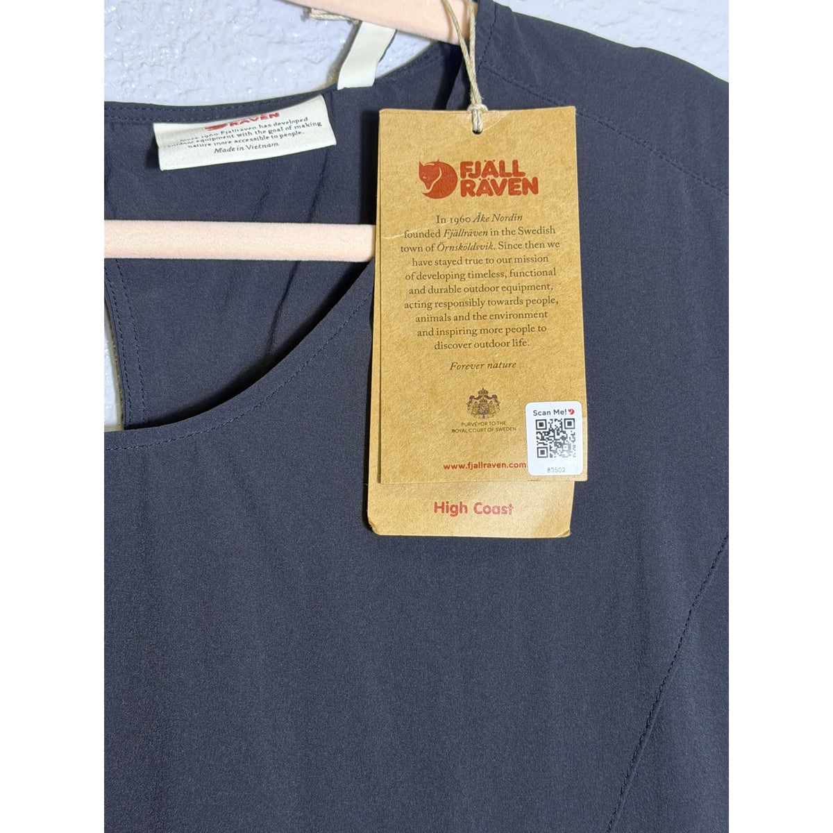 Black Fjallraven High Coast Lite Dress for women in XL size, lightweight and suitable for hiking and travel, shown on a hanger.