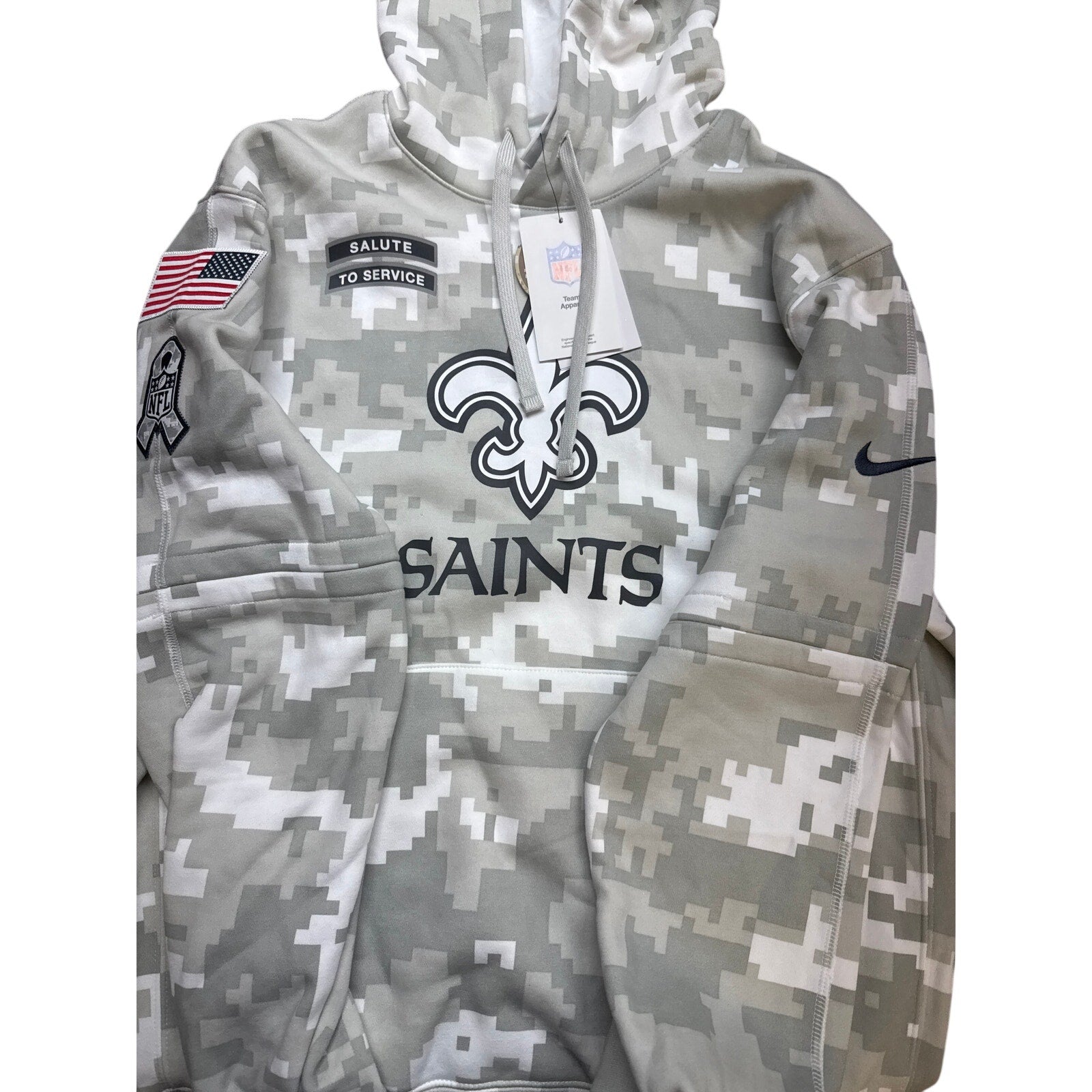 Gray Nike NFL New Orleans Saints "Salute to Service" hoodie with digital camo pattern, featuring team logo and branding.