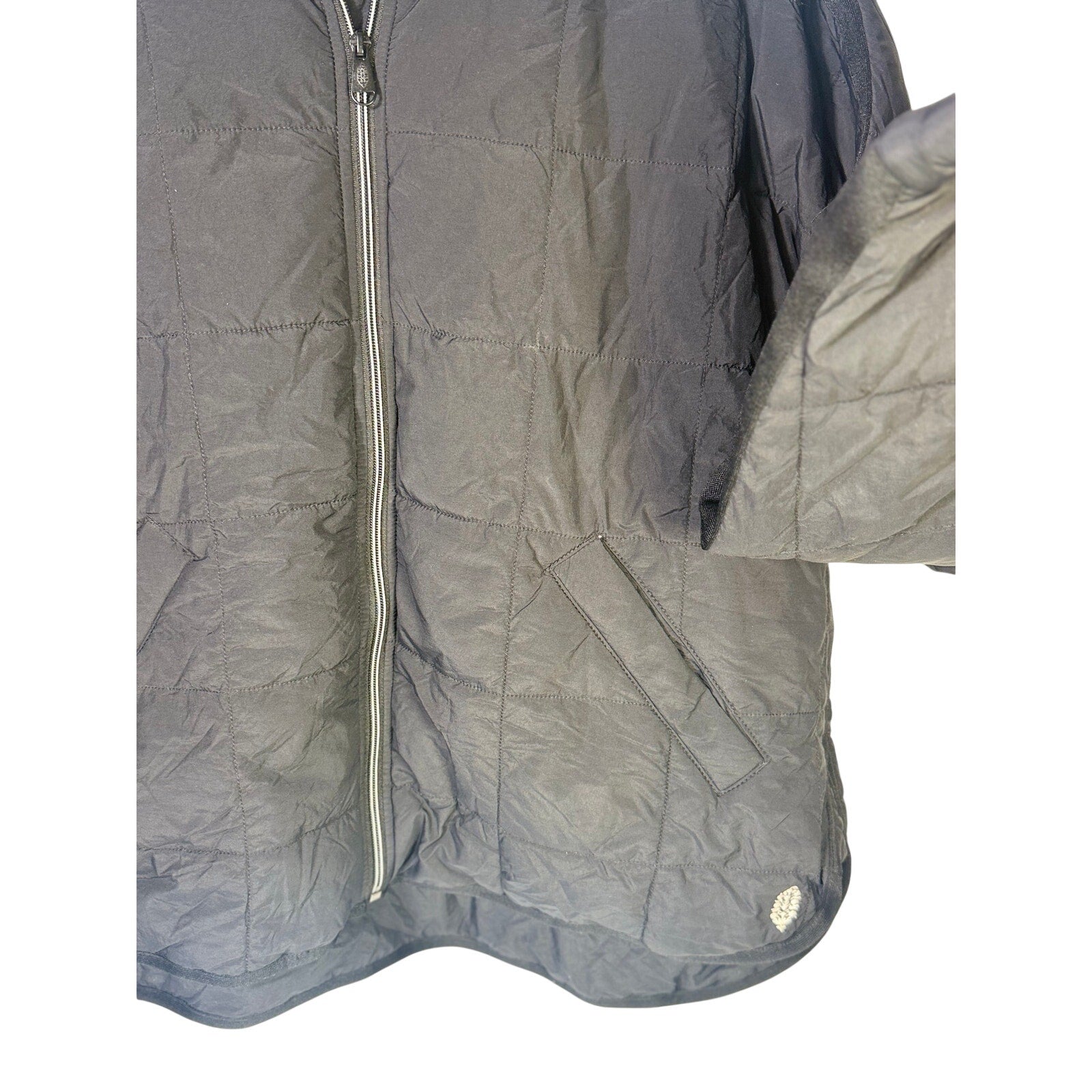 Black quilted Free People Movement women's full zip jacket in size large, shown laid flat with front view.