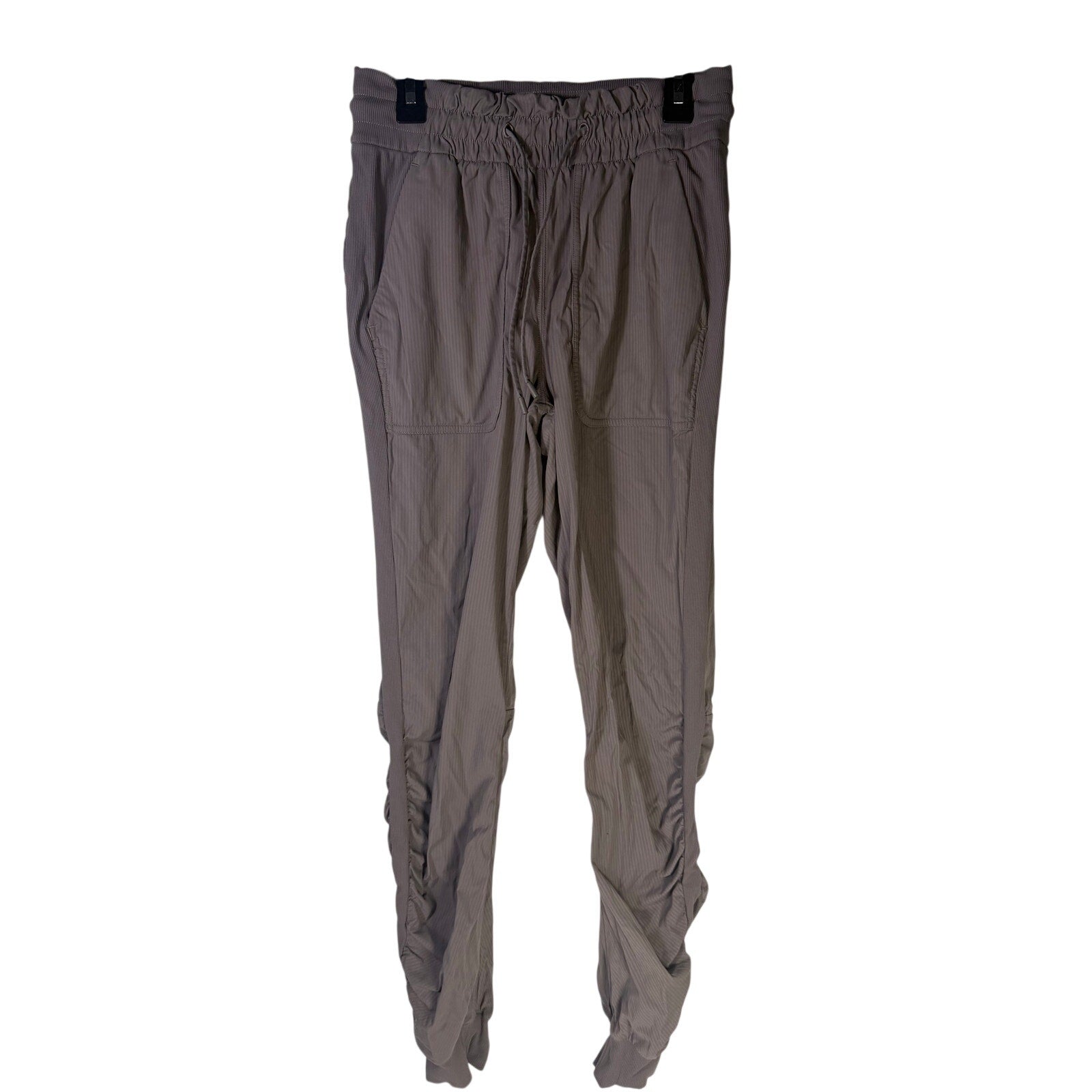 Lululemon women's taupe gray high-rise ruched tapered pants, size 4, preowned, with a fitted waistband and tapered leg design.